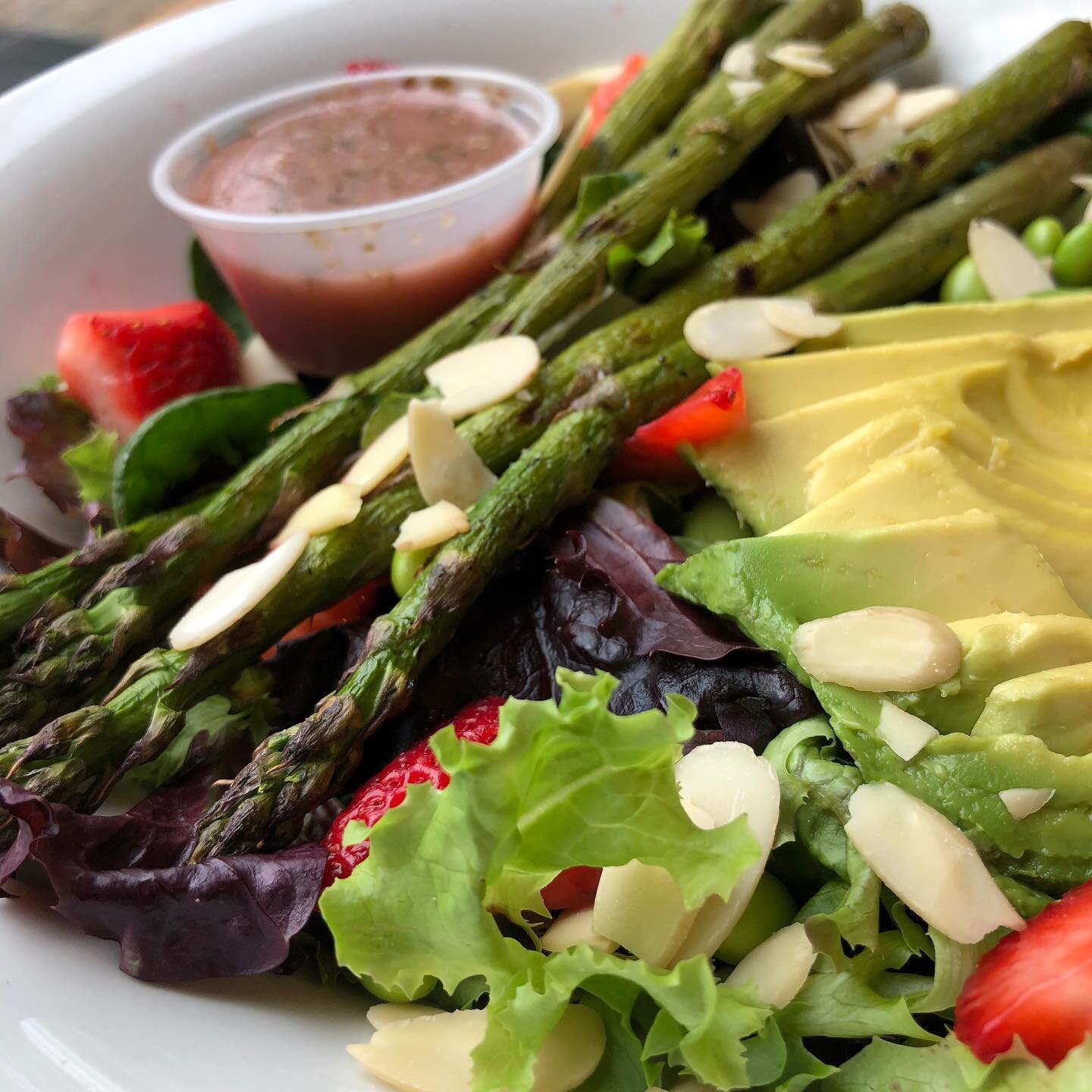 Happy St. Patrick's Day 🍀! Need some greens? We have plenty at Batavia every day 😄. Check our salad special 🥗 today: mixed greens and spinach topped with avocado 🥑, grilled asparagus, fresh strawberries 🍓, edamame, and toasted almonds drizzled w