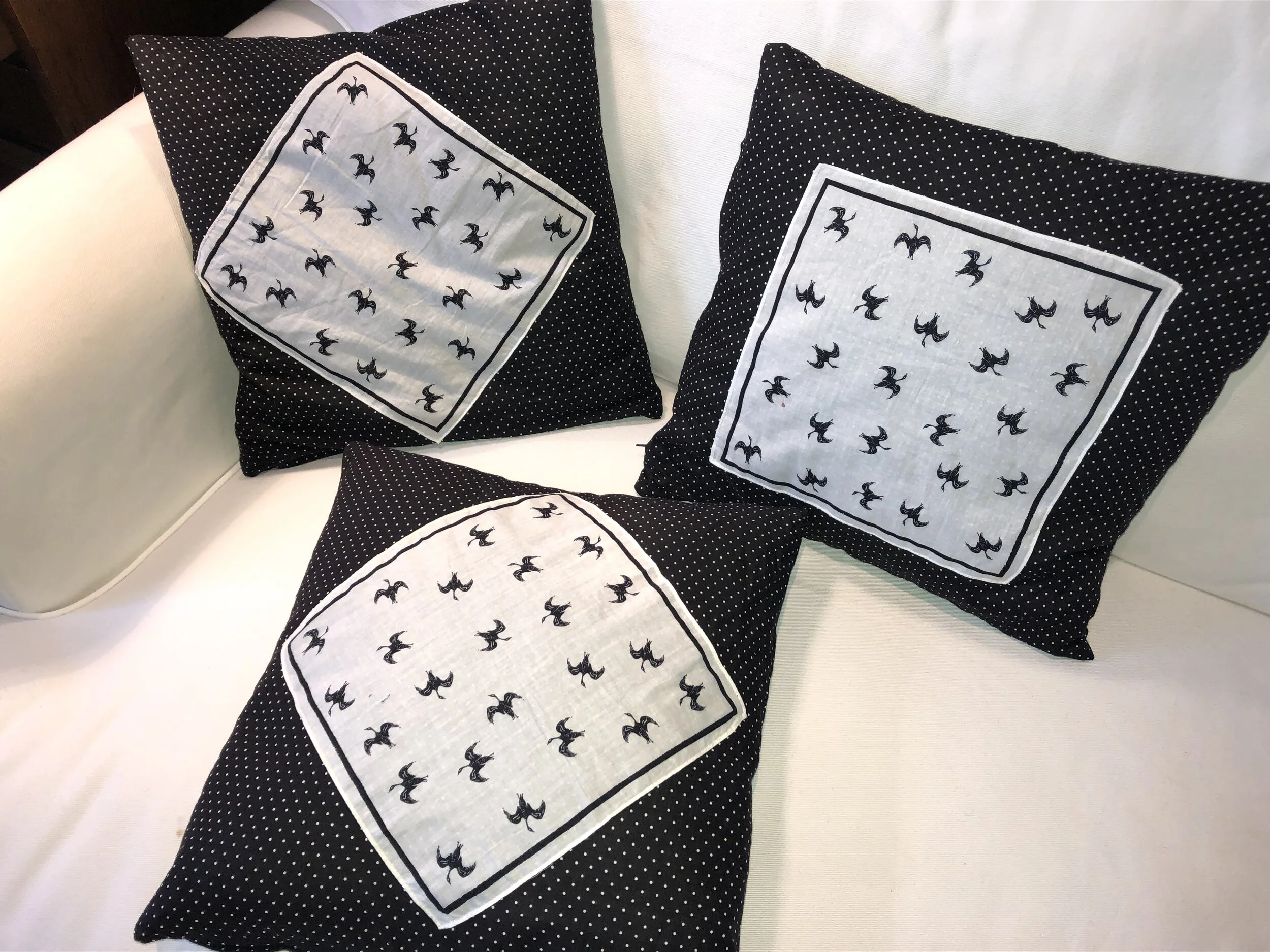 3 Black Goose cushions