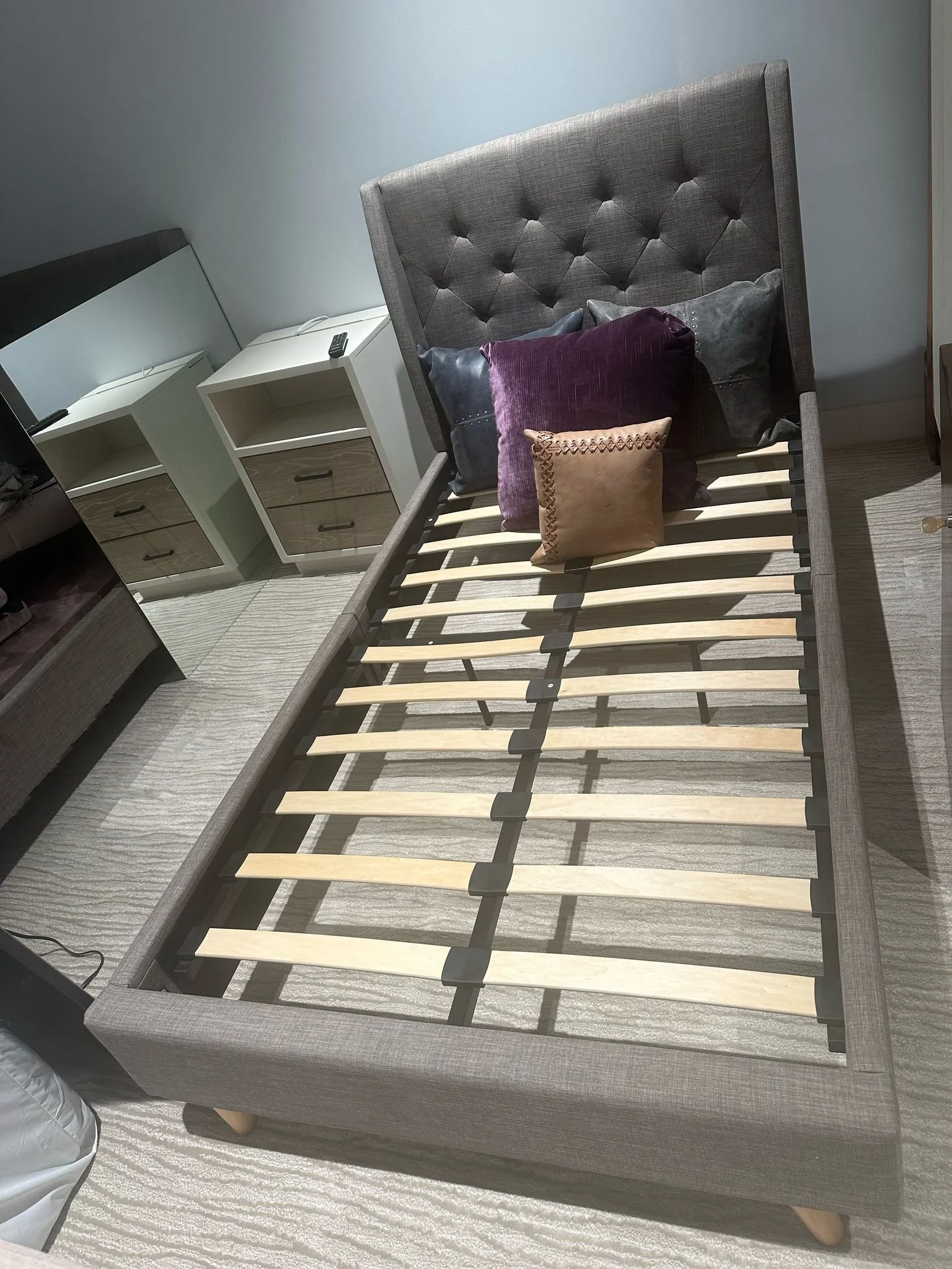 Twin size upholstered gray tufted bed