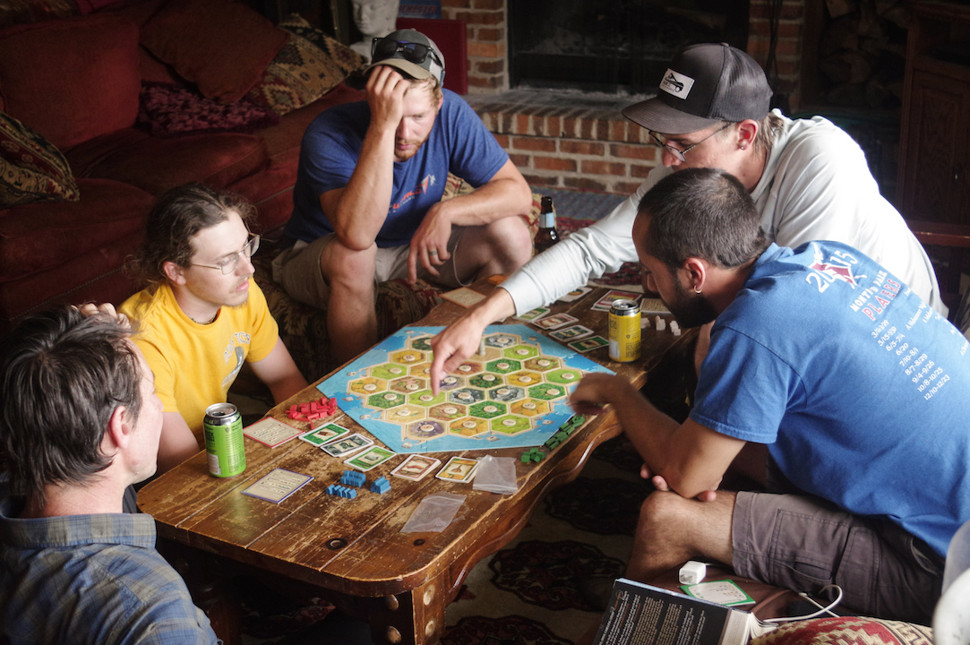 Not everything is work at the Lodge. The guides take a break from days of guiding to play a game of Settlers of Catan. Gabriel, (second from the right) explains the rules to a befuddled crowd.
