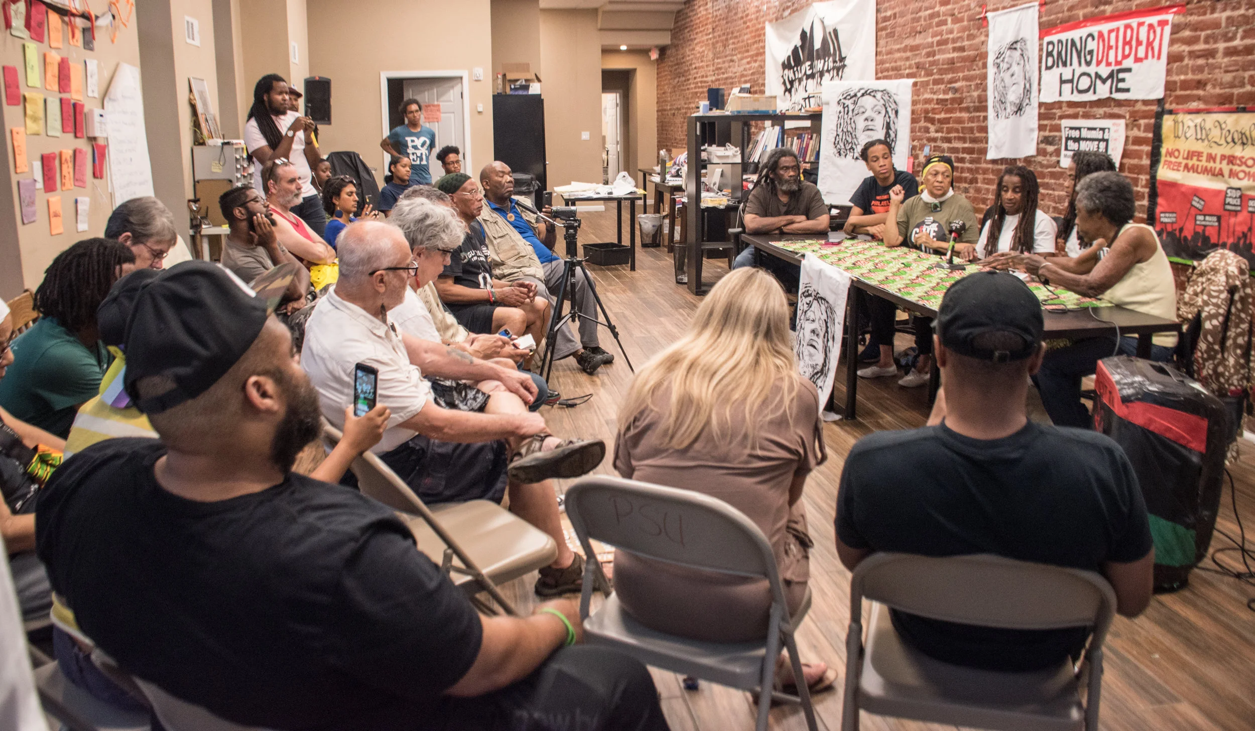 Philadelphia Press Conference Aug 7 warns crowd PA DOC is attempting to kill MOVE 9 unfairly convicted prisoner Delbert Africa. Photo credit: Joe Piette