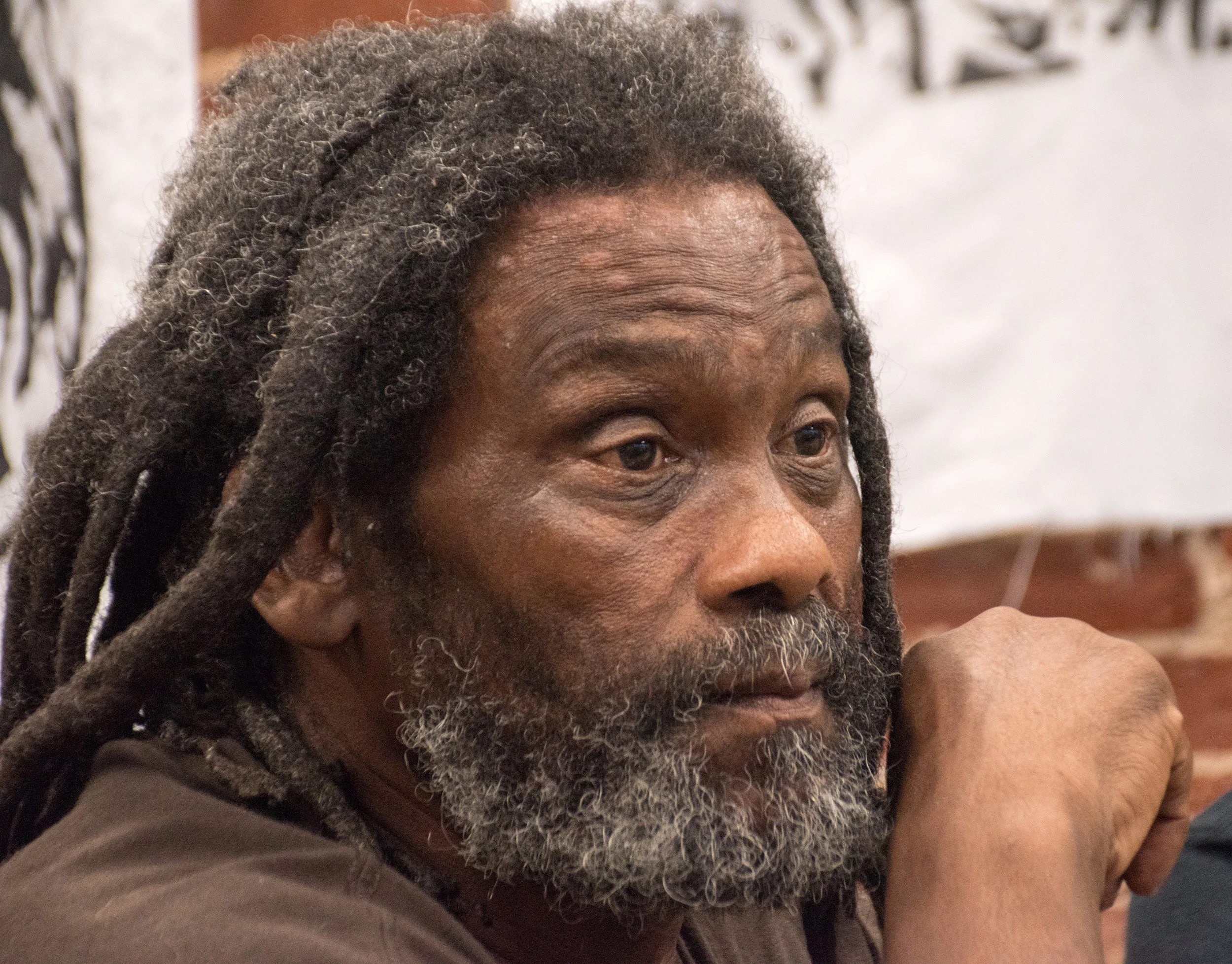 Eddie Africa speaking at Aug 7 press conference for Dilbert Africa. photo: Joe Piette