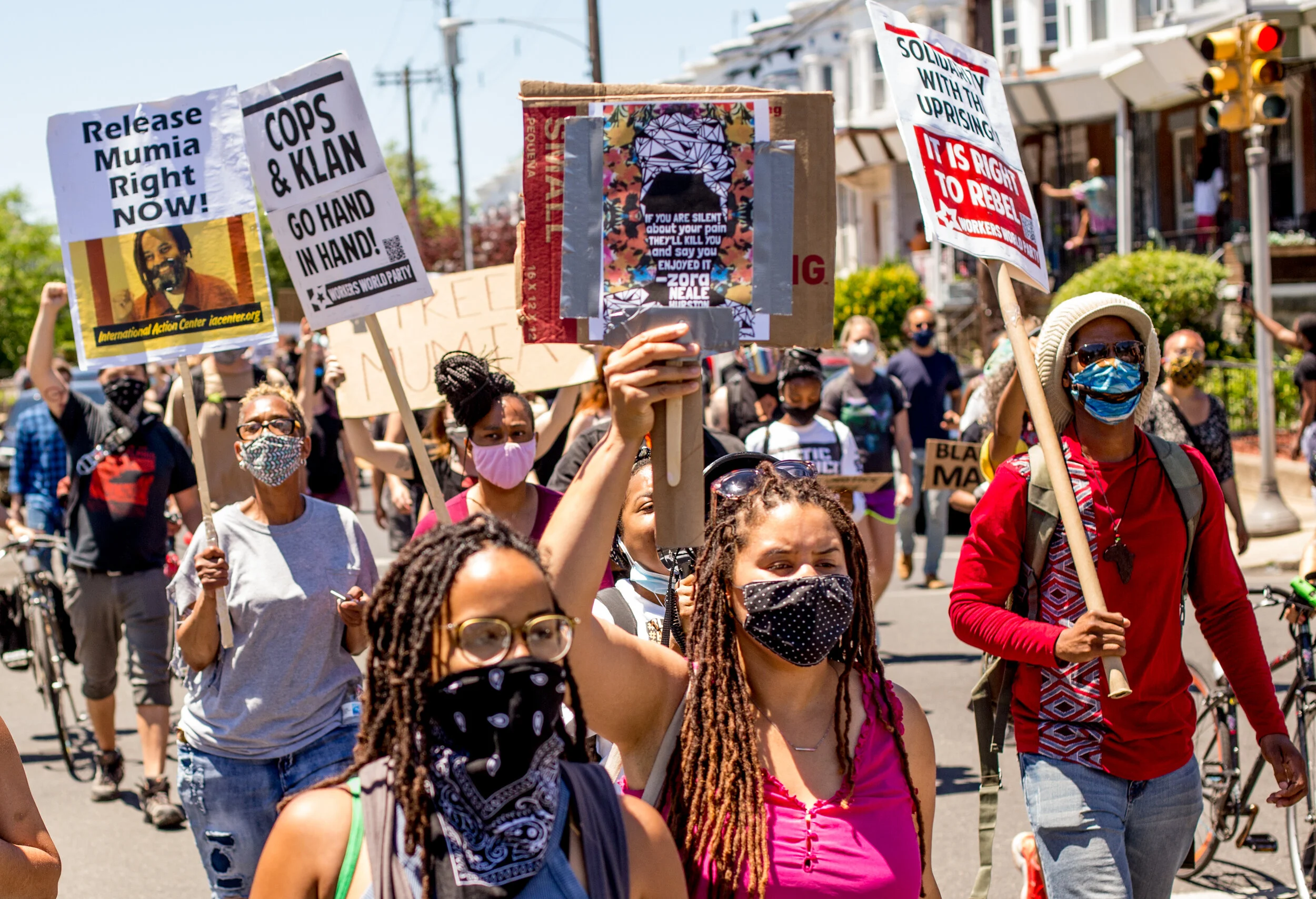 June 13 Philly Protest against Police Terrorism  The ultimate act of police terror in Philadelphia was the bombing of MOVE on Osage Ave on May 13th, 1985. Philly Black Organizations organized a rally and march that started at the site of the MOVE bombing, remembering the MOVE victims and protesting the brutally racist and militarized Philadelphia police force, They also marched in solidarity with George Floyd, Breonna Taylor, Ahmaud Arbery and the countless other Black people murdered by the state in recent years and in centuries prior. On May 13, 1985, Philadelphia police dropped a military grade bomb on members of the MOVE organization living at 6221 Osage Ave. Eleven Black men, women and children were murdered after police ordered fire fighters to "let the fire burn" &amp; shot MOVE members back into the home as they tried to escape. The violent attack came after over a decade of police violence &amp; repression of MOVE activists, including the MOVE 9 who were political prisoners for 40 years. A Black neighborhood was destroyed in the process. This action started at the site of this horrific act of Philadelphia police terrorism at Osage Avenue and Cobbs Creek Parkway and ended with another rally at Malcolm X Park. Co-organizers: The MOVE Organization, BLM Philly, Philly for REAL Justice, Human Rights Coalition Philadelphia, Abolitionists Law Center Philadelphia, Malcolm X Grassroots Movement, Ubuntu Philadelphia and Mobilization4Mumia. More photos at https://www.flickr.com/photos/109799466@N06/albums/72157714694717901/with/50003577722/