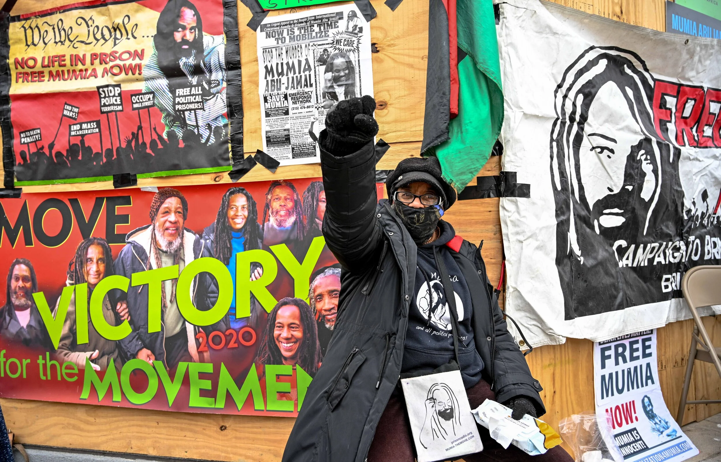 Longtime Free Mumia activist Linda Ragin raises her fist at the Dec 9 press conference in Philadelphia marking the 39th anniversary of the day Abu-Jamal was shot and wrongly arrested for the murder of a Philadelphia police officer. The gathering also marked the release of his new book Perfecting Tyranny. More photos at  https://www.flickr.com/photos/109799466@N06/albums/72157717232352188
