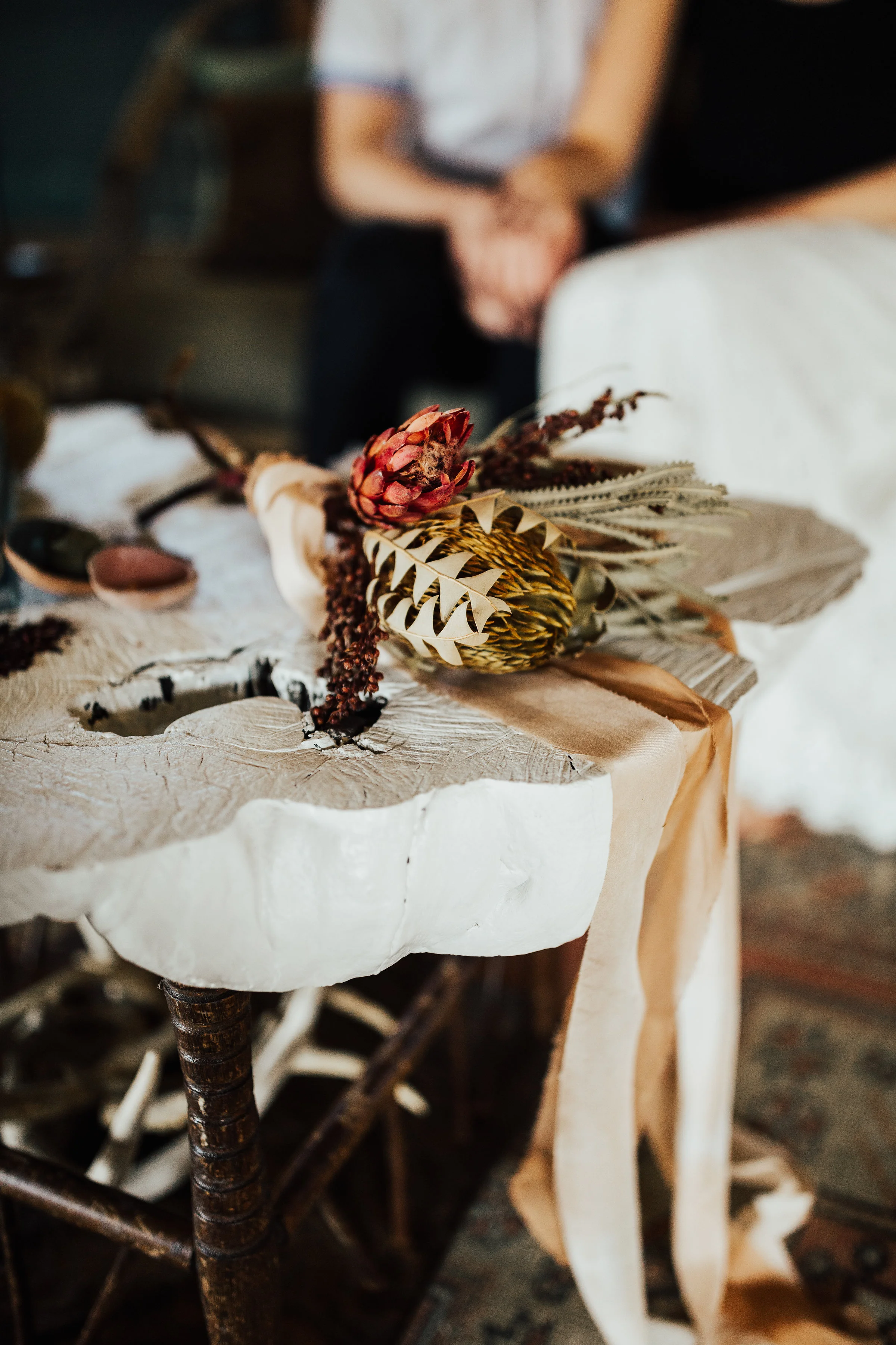 photo by Tana Helene, ribbon by Rosemarine Textiles, rugs by The Good Rug, bouquet by Birch Affair
