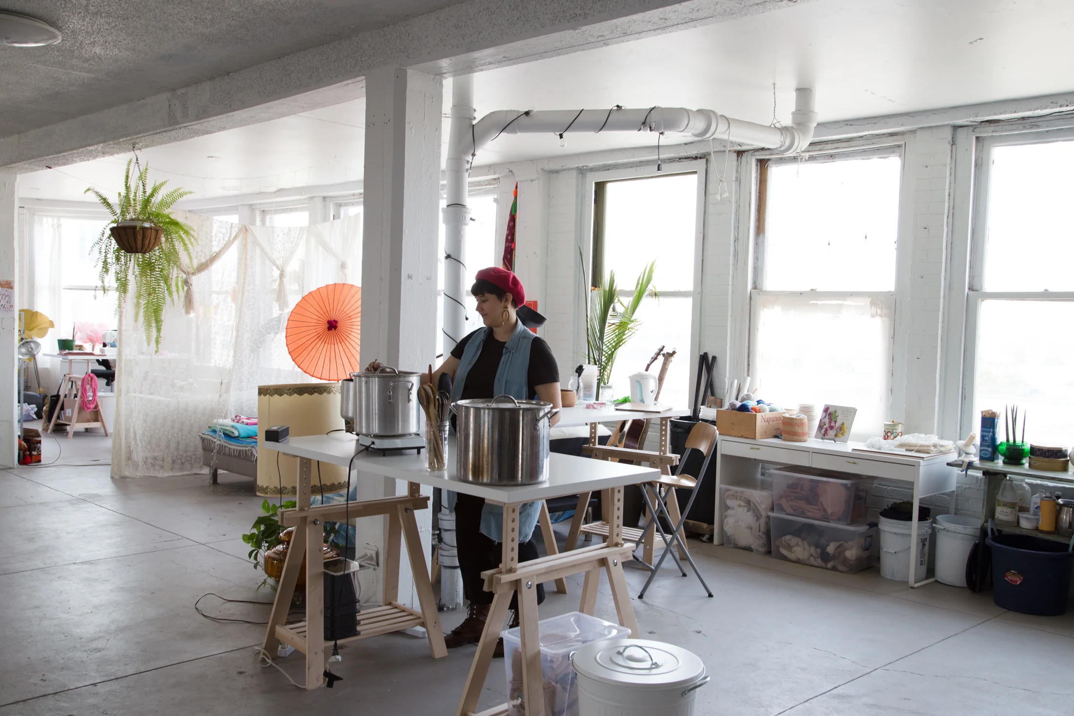 doing my thing in my studio space, stirring a pot of dye