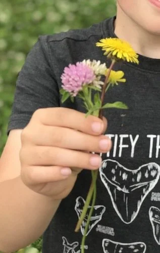 Stock+Photo+Kid+Wild+Flowers.webp