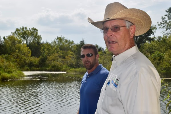U.S Congressman Markwayne Mullin is shown with Robert Toole, Director of Abandoned Mine Land (AML) Reclamation Program for the Oklahoma Conservation Commission (OCC), recently near Porum at an abandoned coal mine strip pit to discuss the successes and the continued significant importance of the Abandoned Mine Land (AML) Reclamation Program.