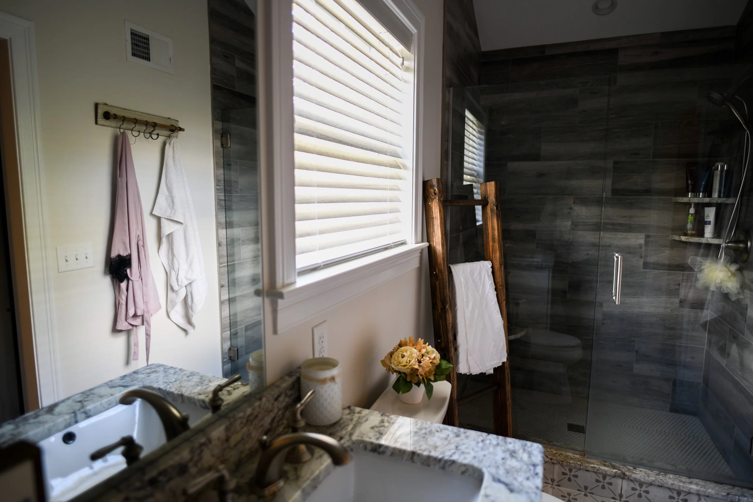 Rustic and sleek- these beautiful wire-brushed 2 inch wood blinds that were added, were a staple in bringing together the design on this new construction in branford, CT