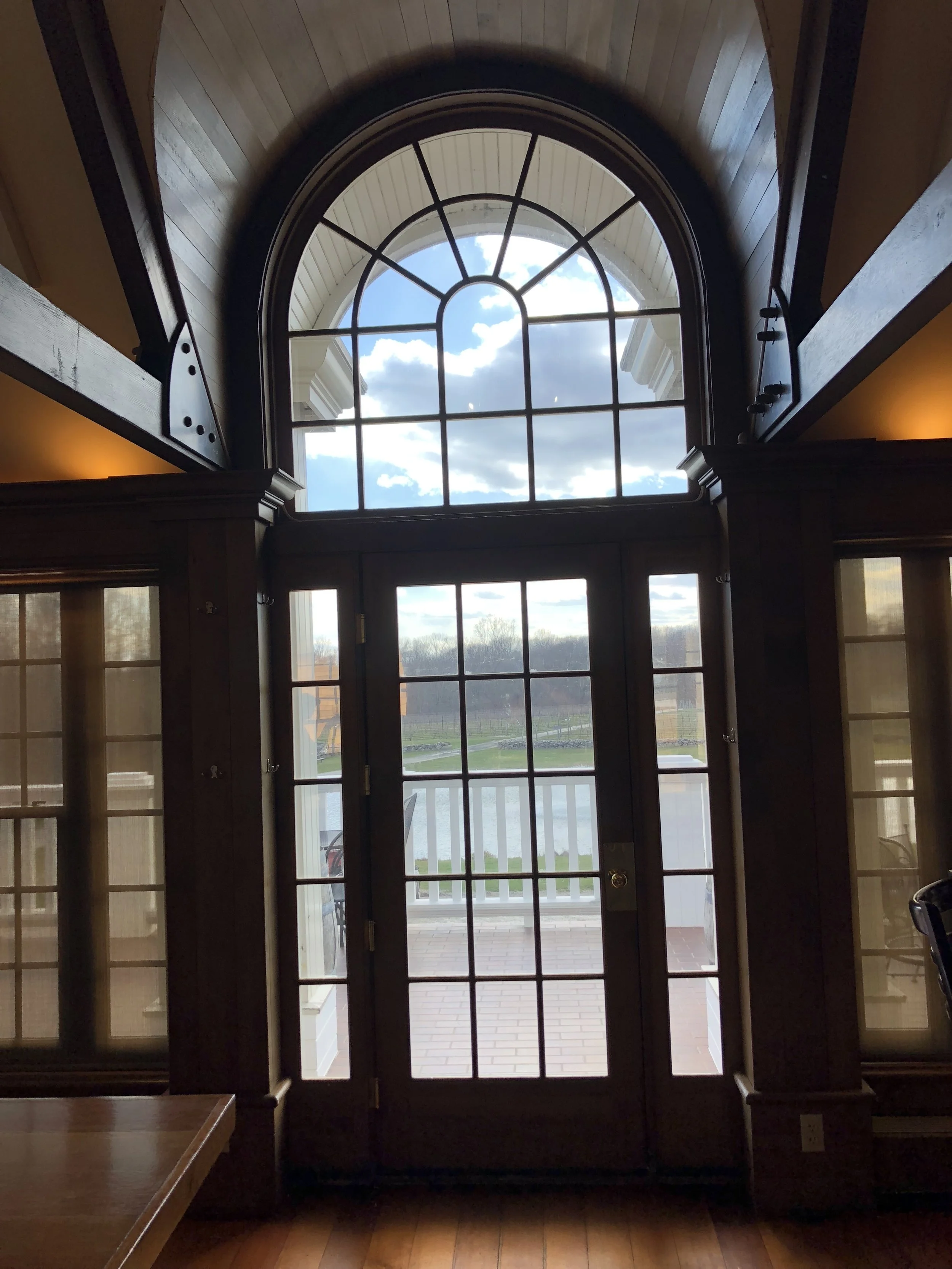 although possible- speciality window treatments aren’t always financially practical- here in clinton, ct we installed solar window film that eliminated harsh uv rays which turned this room into a greenhouse, without COMPROMISING this priceless view of the vineyards.
