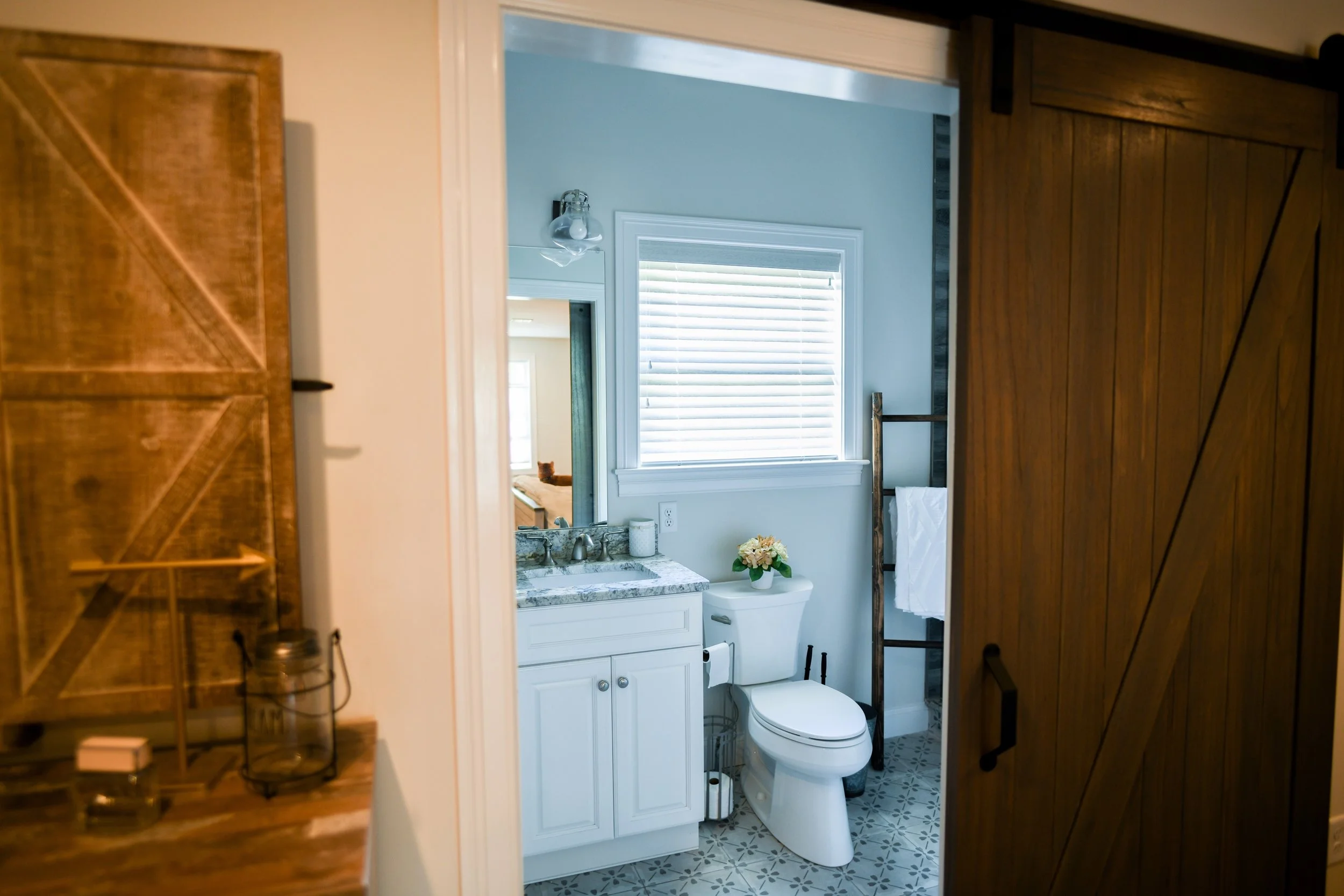 Rustic and sleek- these beautiful wire-brushed 2 inch wood blinds that were added, were a staple in bringing together the design on this new construction in branford, CT