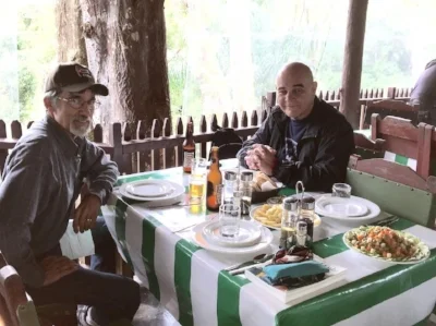 Pauline’s husband, Richard, enjoying a meal with our new friend and local guide, Fidel