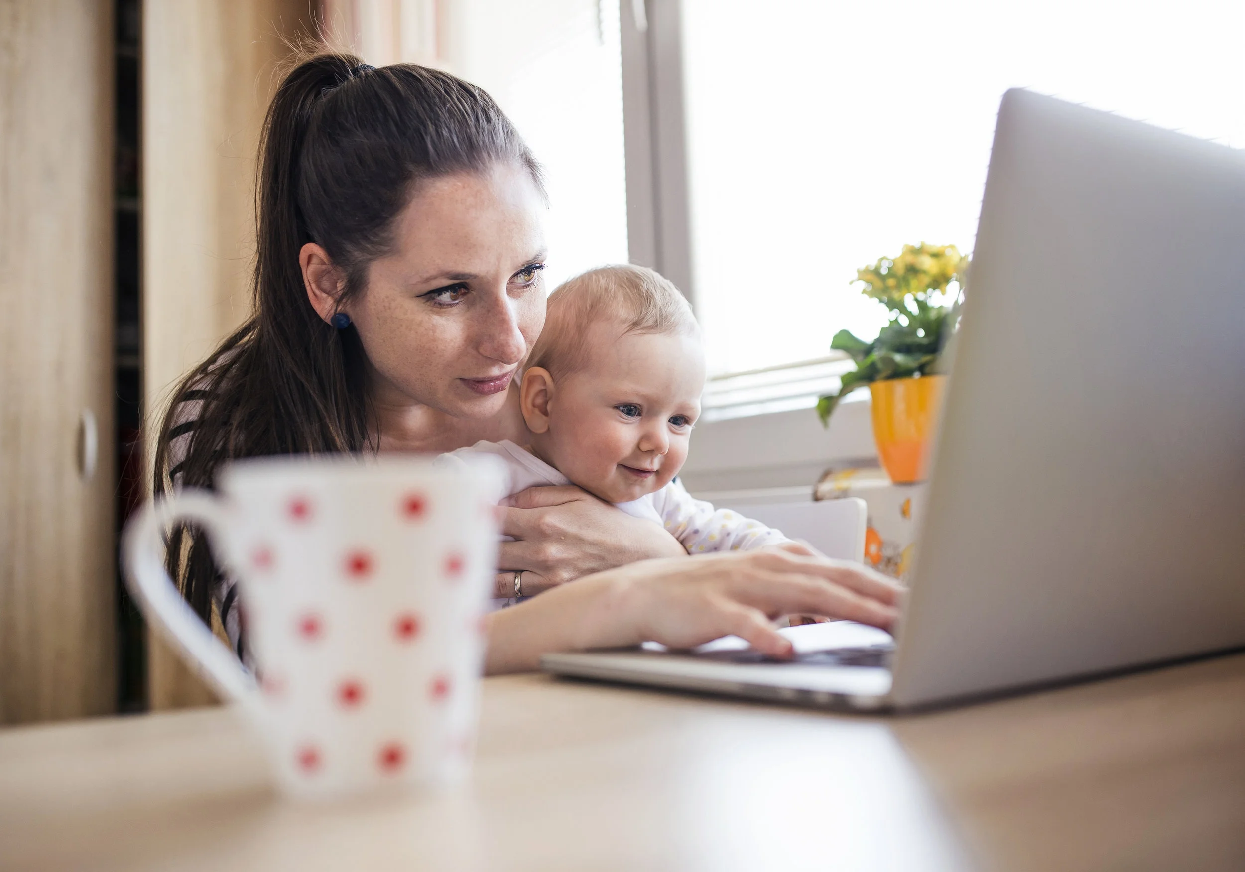 bigstock-Young-mother-working-from-home-88454573.jpg