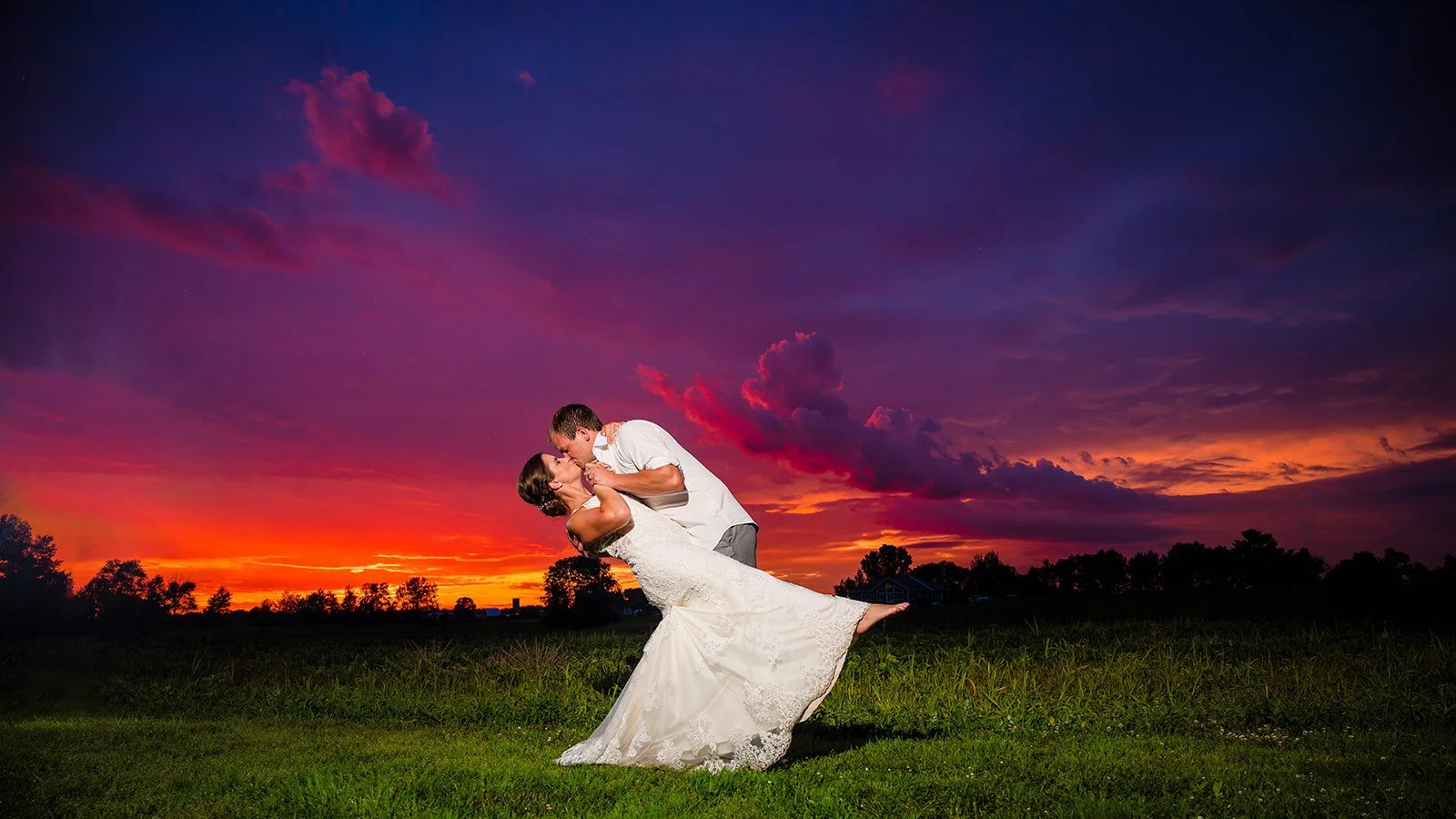 Brilliant Sky photo of groom and bride kissing infront of a stunning sunset Twin Birch Studio
