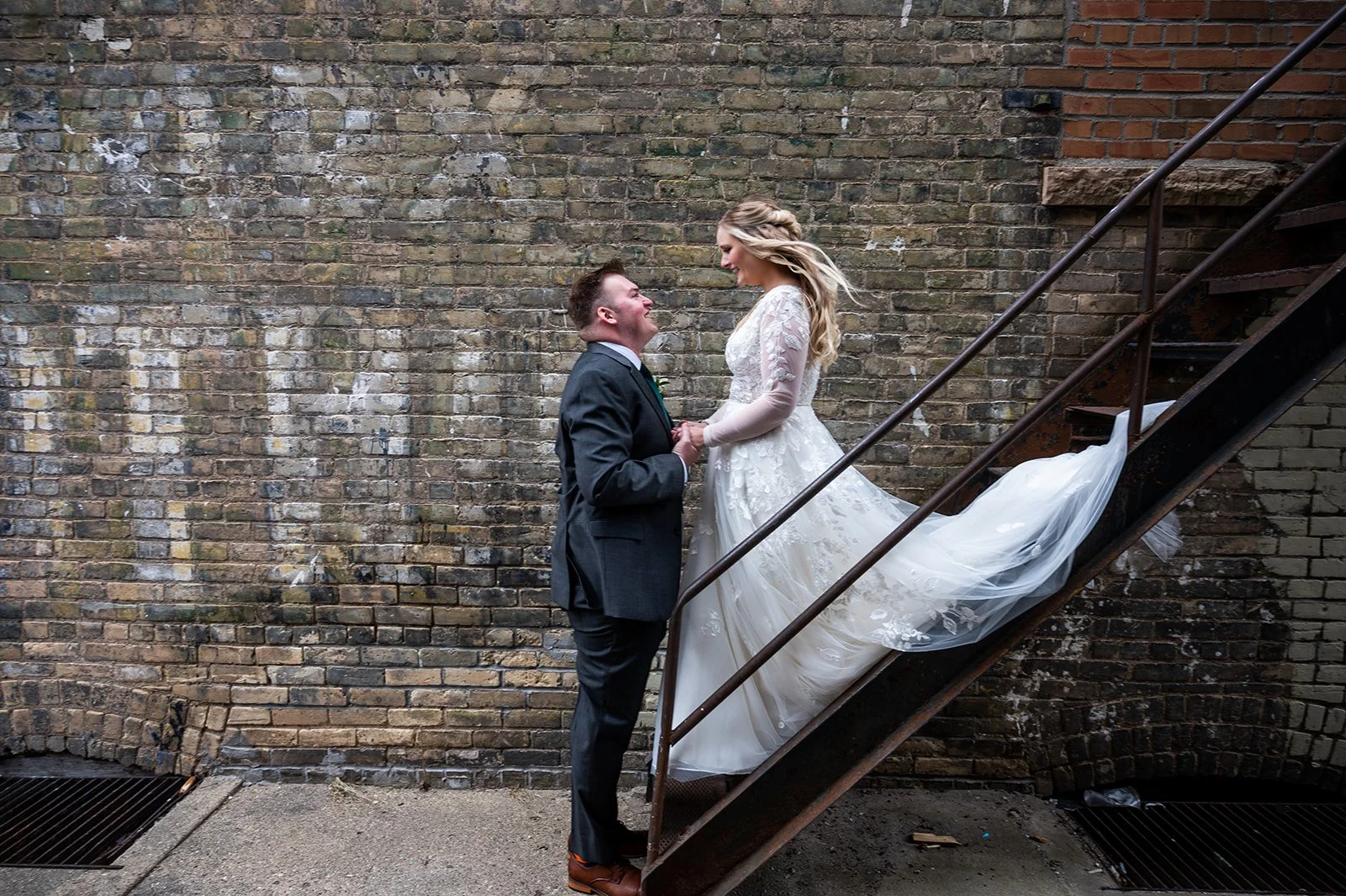 Metropolitan Setting Brick Background Couple Photograph while getting married Twin Birch Studio