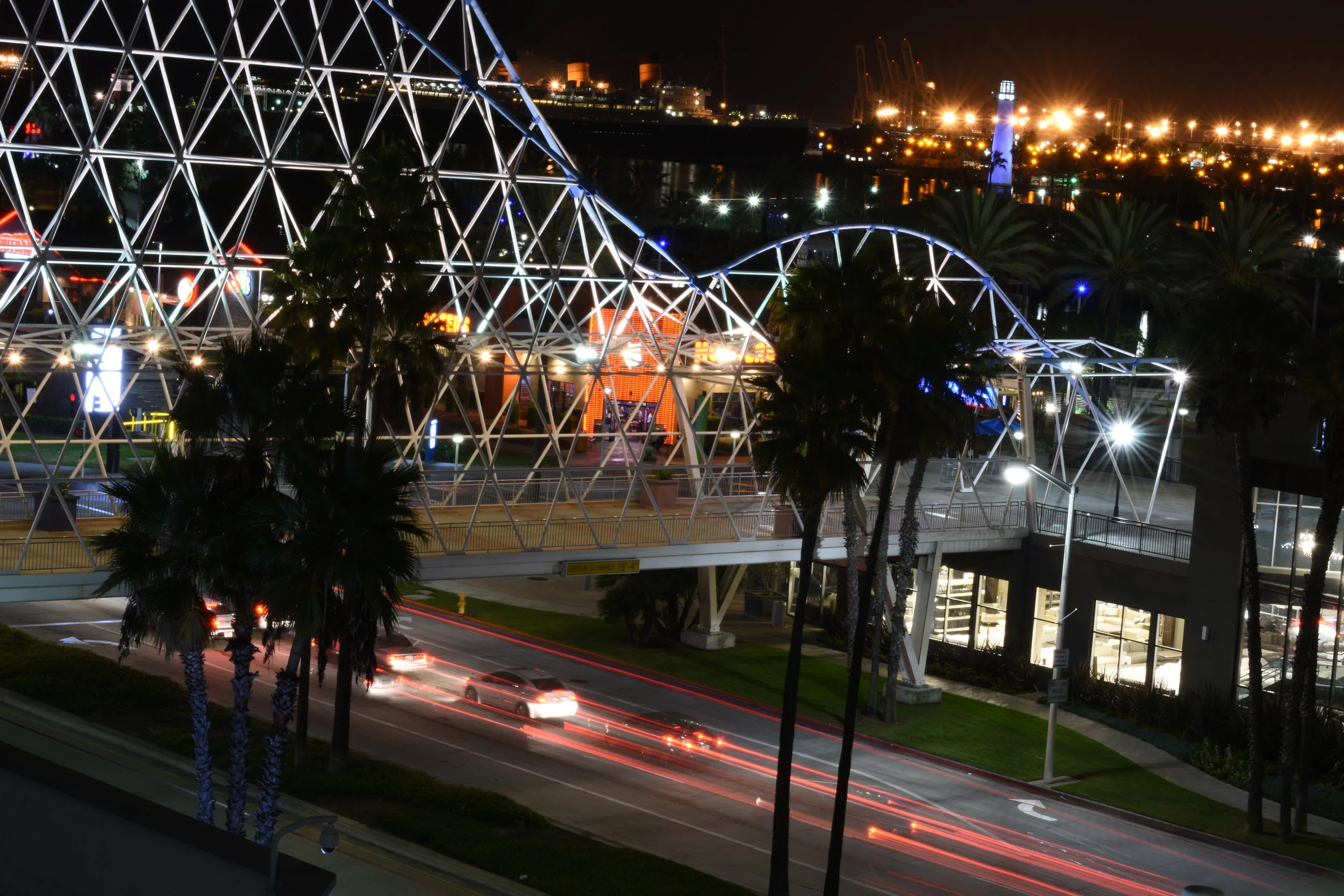 Cars at night racing through the pike
