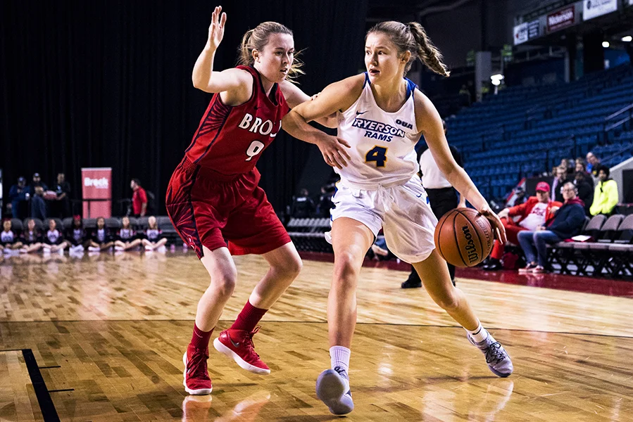 Miranda Smith (#9) of the Brock Badgers guards Marin Scotten (#4) of the Ryerson Rams during regular season play on November 17, 2018 at the Meridian Centre in St. Catharines, Ontario, Canada.