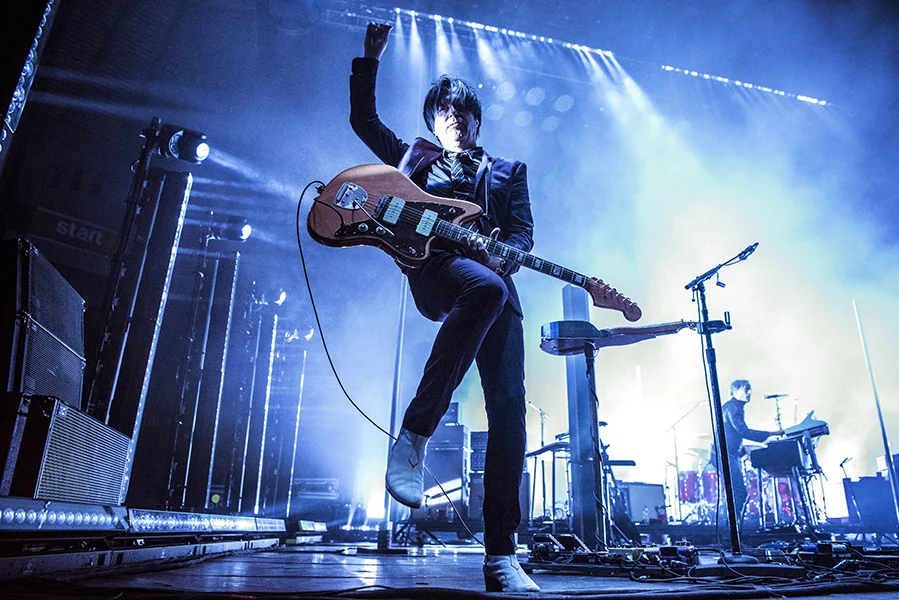Lead-guitarist, Troy Van Leeuwen, performs with Queens of the Stone Age in London, ON.