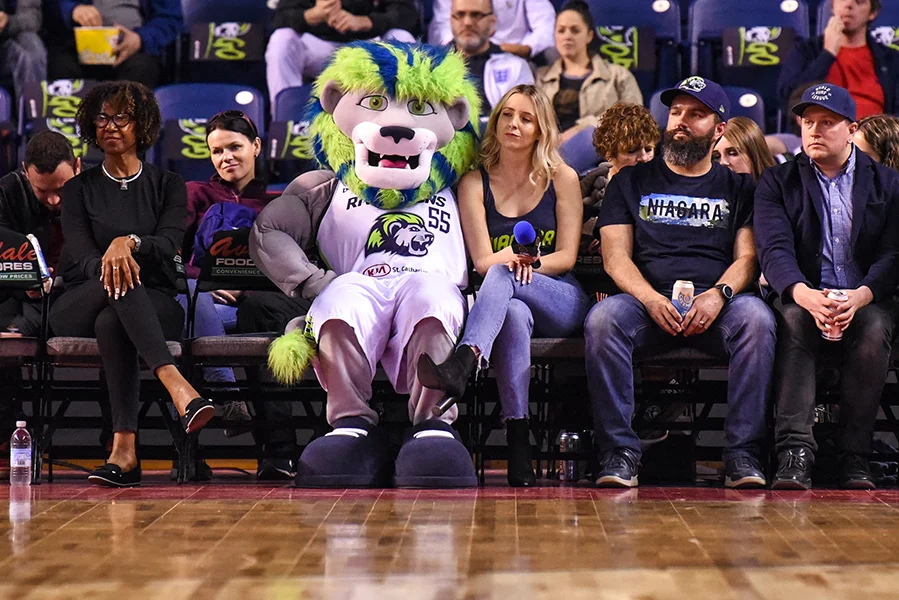 The Niagara River Lions' mascot, Dunkin, sits court-side during the team's game against the Edmonton Stingers. Niagara defeated Edmonton 108-66.