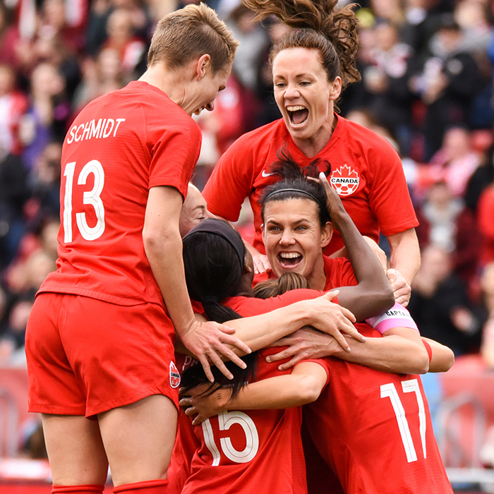 May 18, 2019: Team Canada forward Christine Sinclair (12) is swarmed by her teammates after scoring a goal against Mexico during an international friendly at BMO Field in Toronto, Ontario. Canada defeated Mexico 3-0.