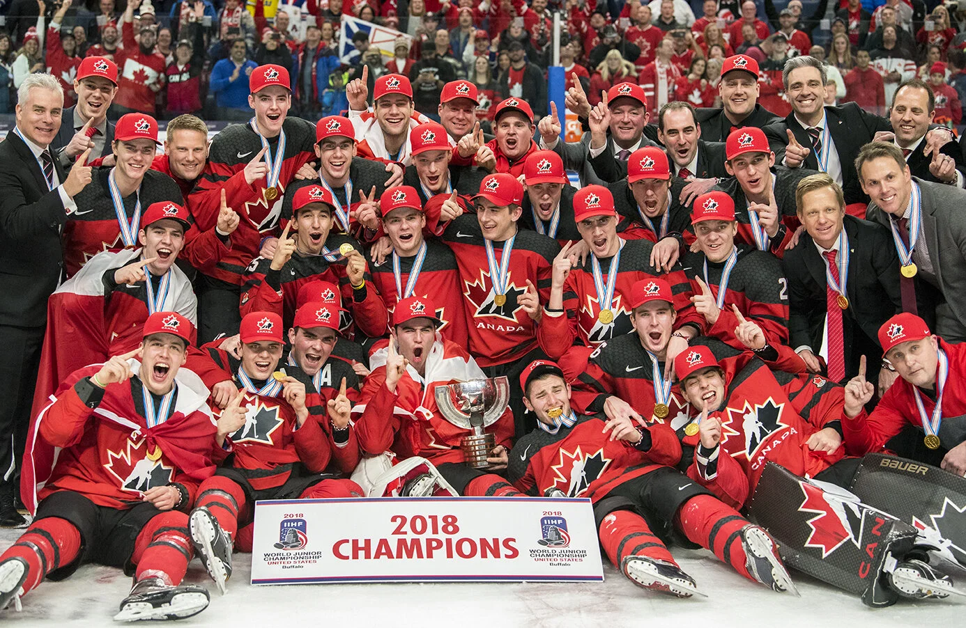 Team Canada poses for a photo following their victory at the 2018 IIHF World Junior Championship.