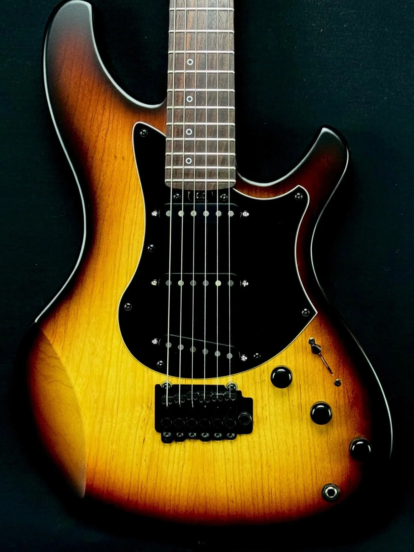 This is the Torzal Crescent guitar. Swamp ash body with a Torzal SustainCore hybrid neck. The Crescent is light, stable and responsive, and it got a lot of attention at NAMM 2026! 
The SustainCore neck is torrefied sugar pine, wrapped with carbon fib