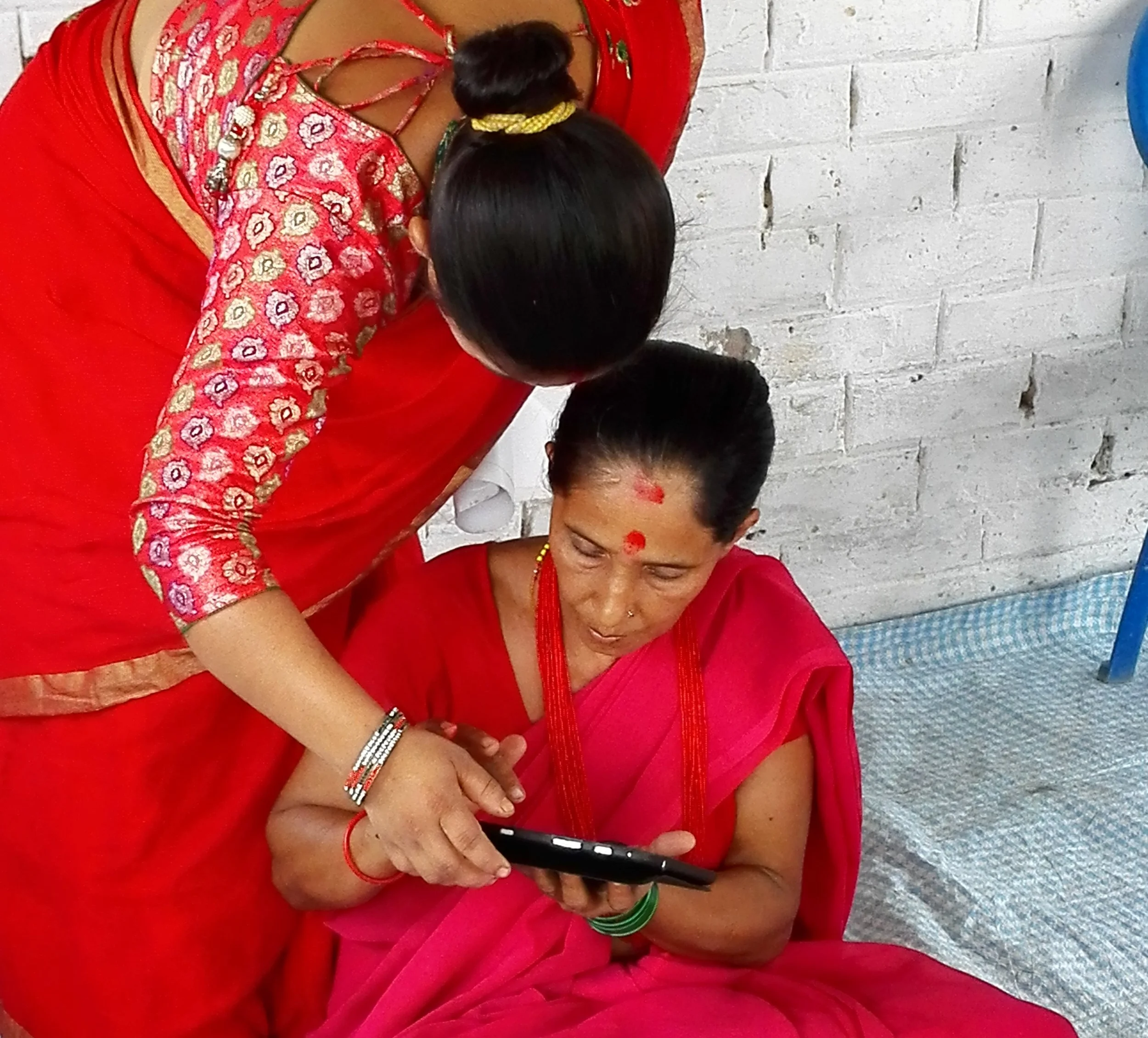 Learners using the tablet for the first time in Nepal.jpg