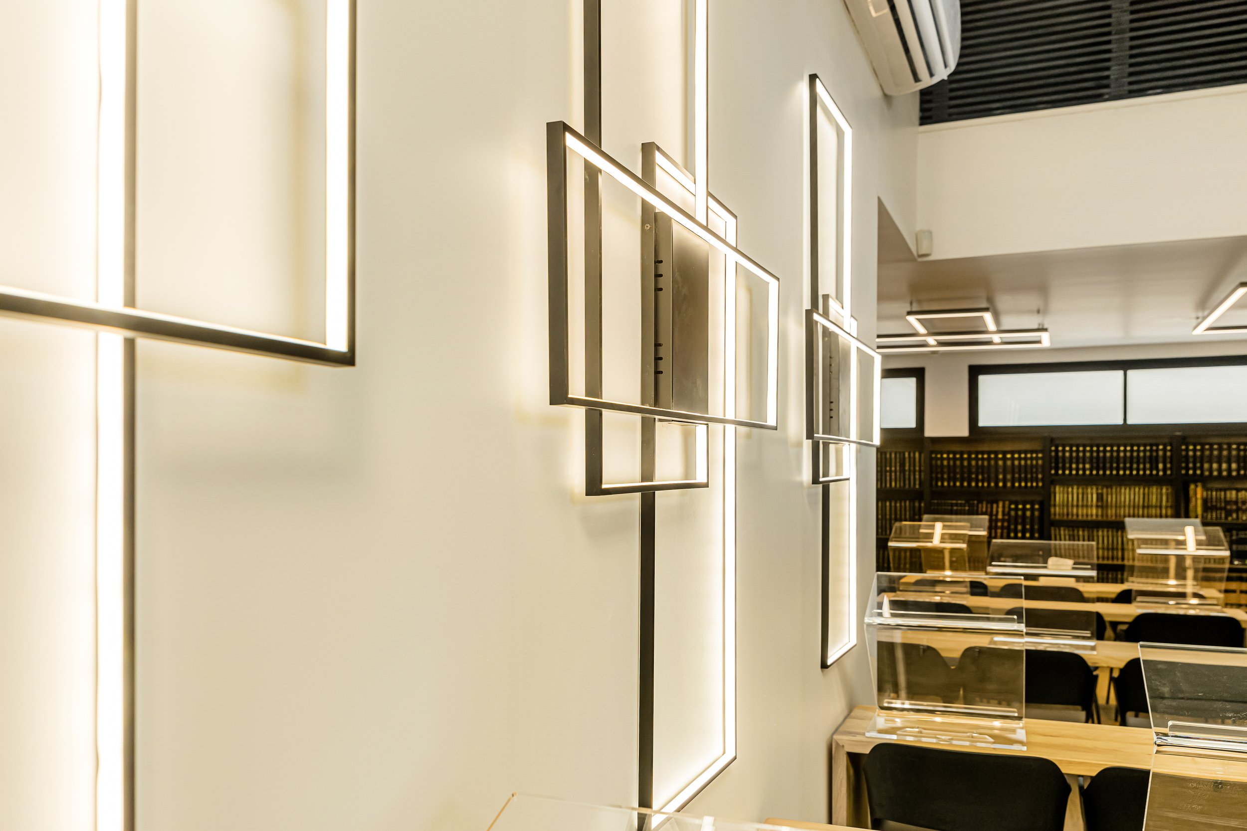  Experience the perfect harmony of old and new at the modern Kollel in Raanana, where contemporary style meets age-old wisdom. Adorned in sleek black and white, this dynamic institution radiates elegance and charm.    