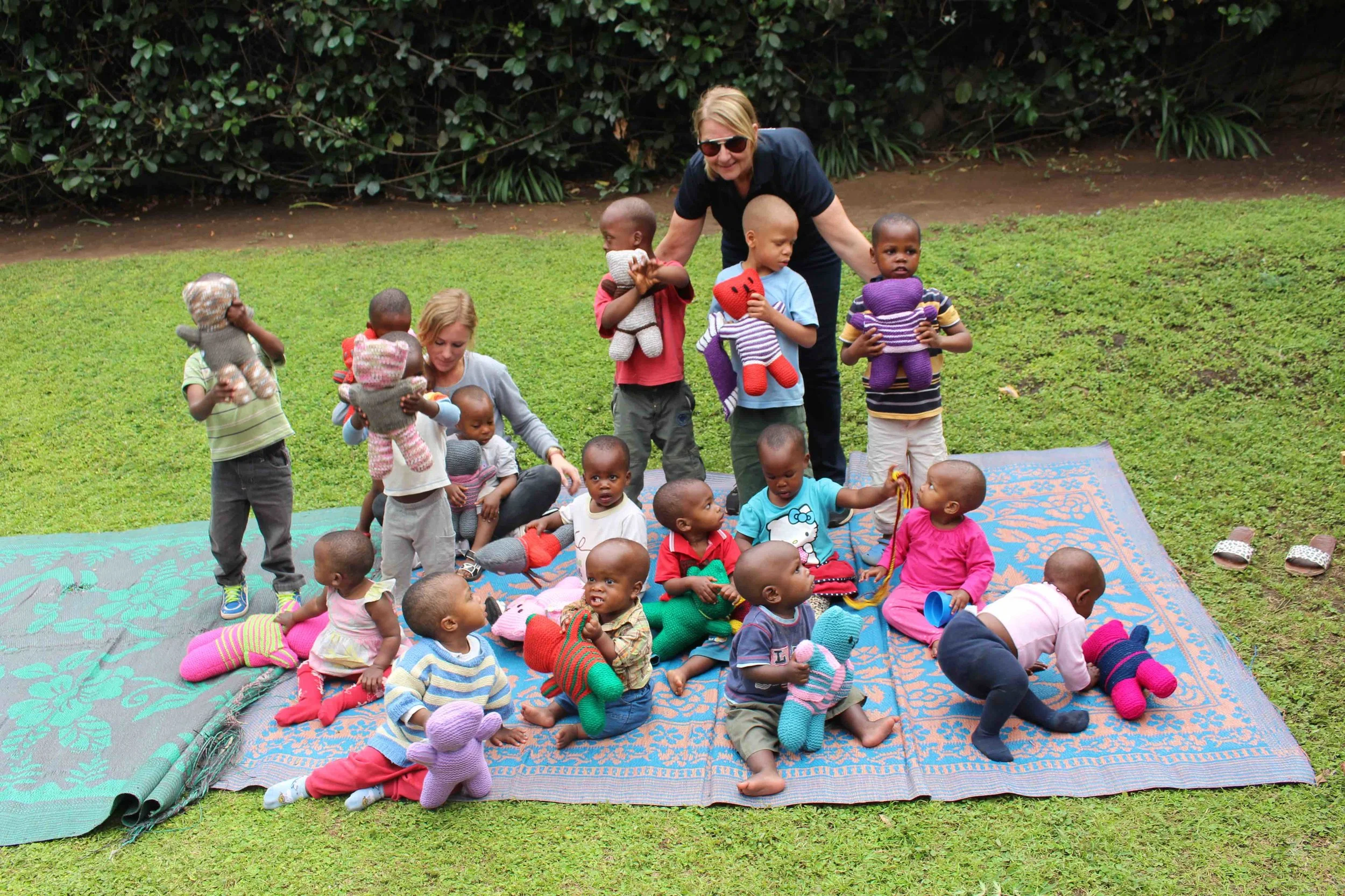 Distributing teddies in Arusha, Tanzania. Cradle of Love