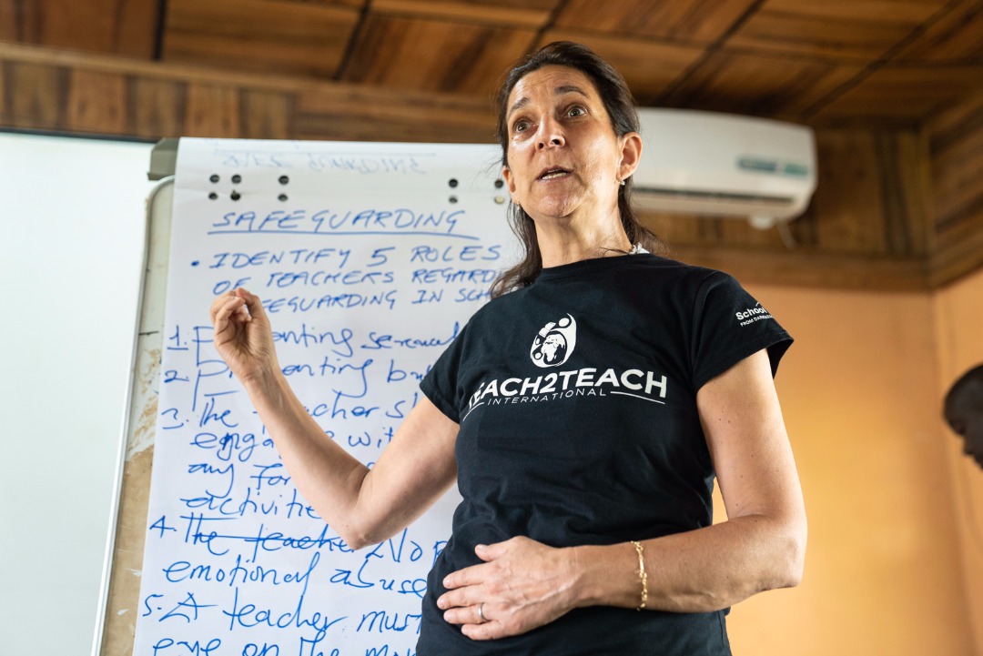 Anita next to board.jpeg