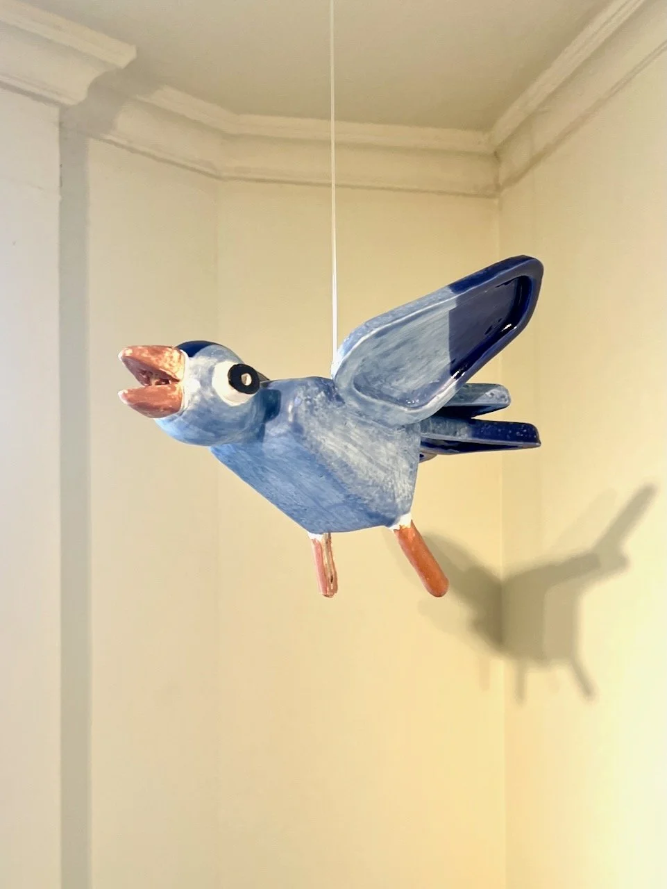  Steve Keister&nbsp;  2-Toned Blue Bird  Glazed ceramic with monofilament&nbsp; 5” x 8.5” x 8” 
