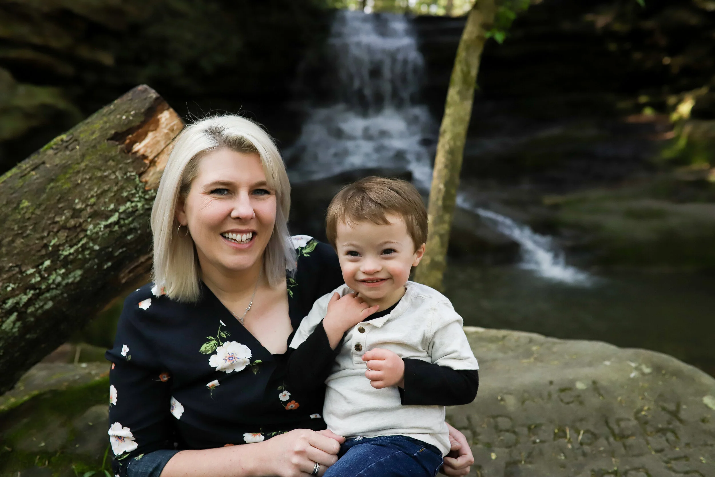 mother and young son with down syndrome smiling