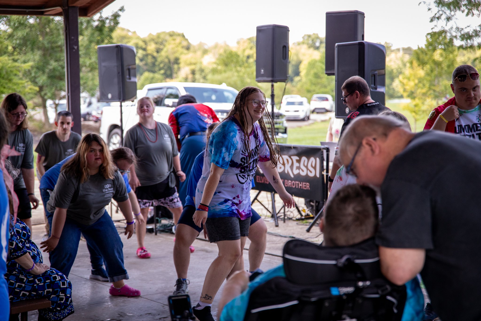large group of people dancing at an event.