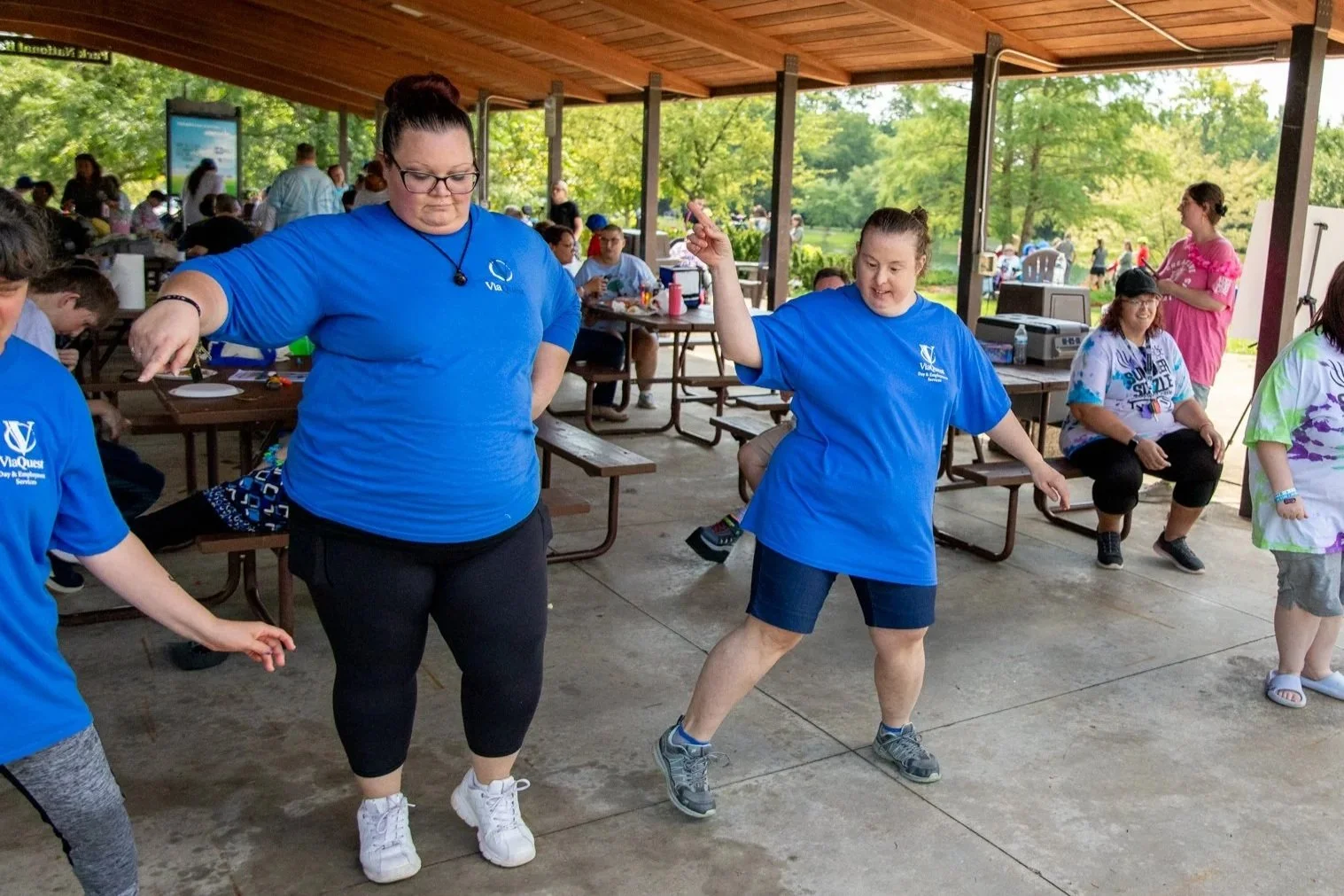 a few people dancing toether