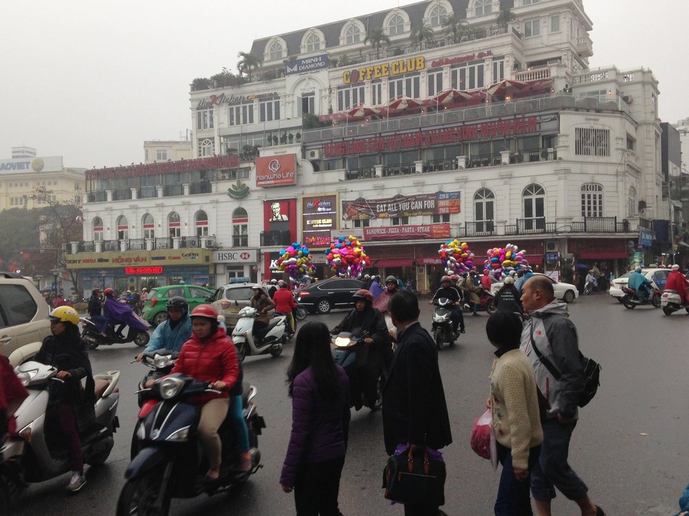 Teeming Hanoi. The only way to cross the road is to walk out into the traffic.....and keep walking!