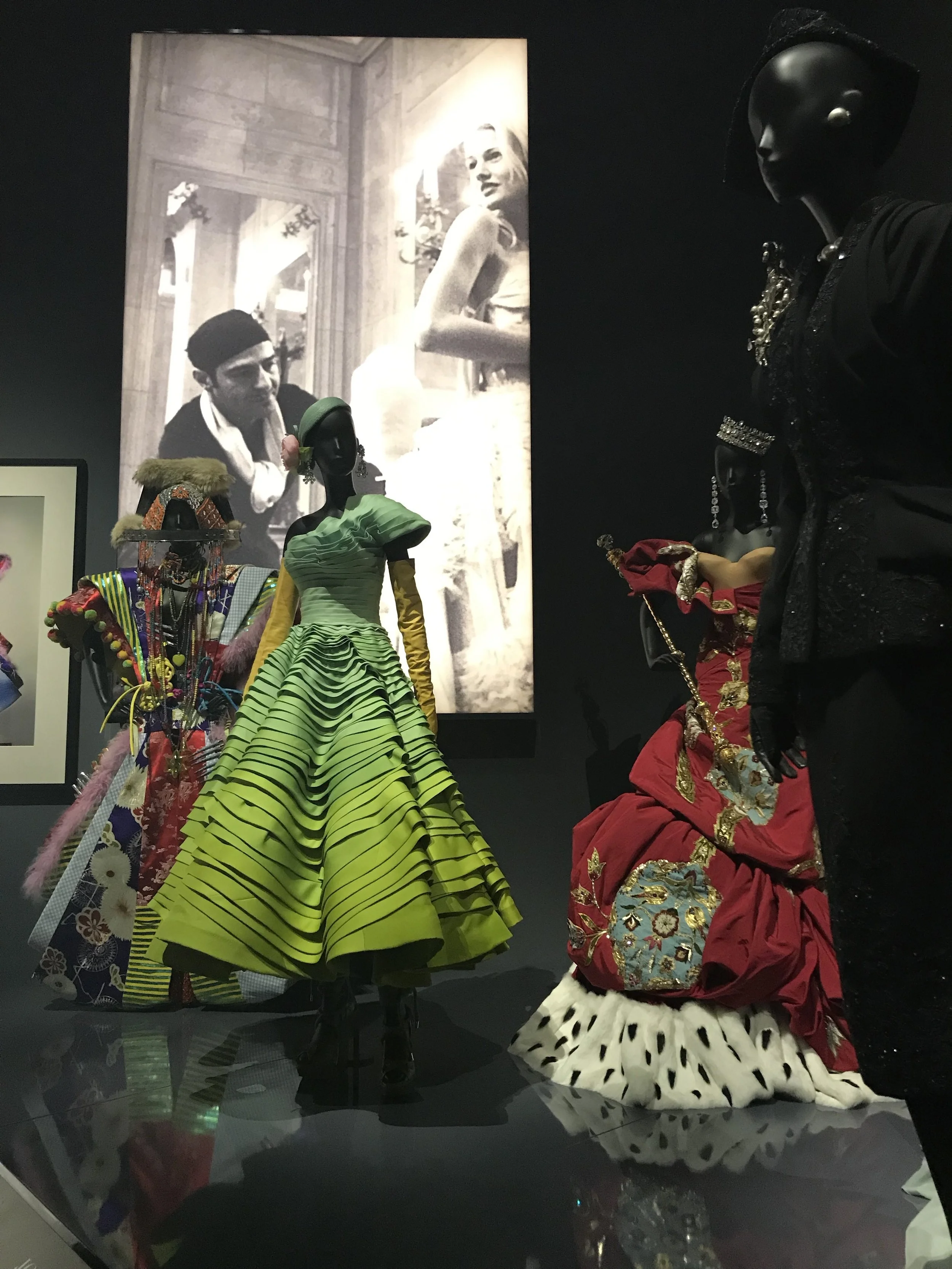 A shot of John Galliano provides the backdrop for some of his Dior designs