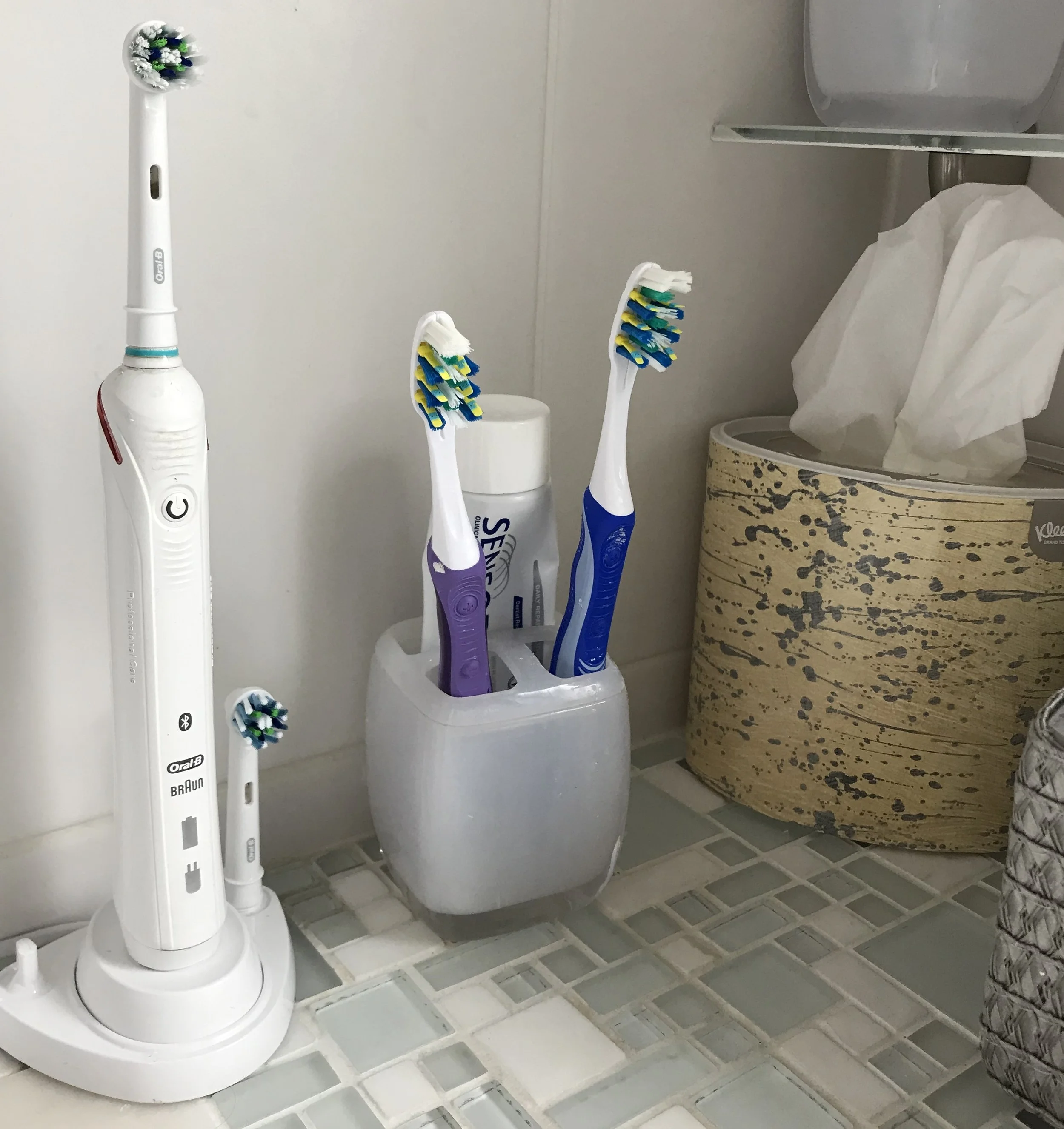 My new electric toothbrush, with the sort of ones I used to use alongside it.