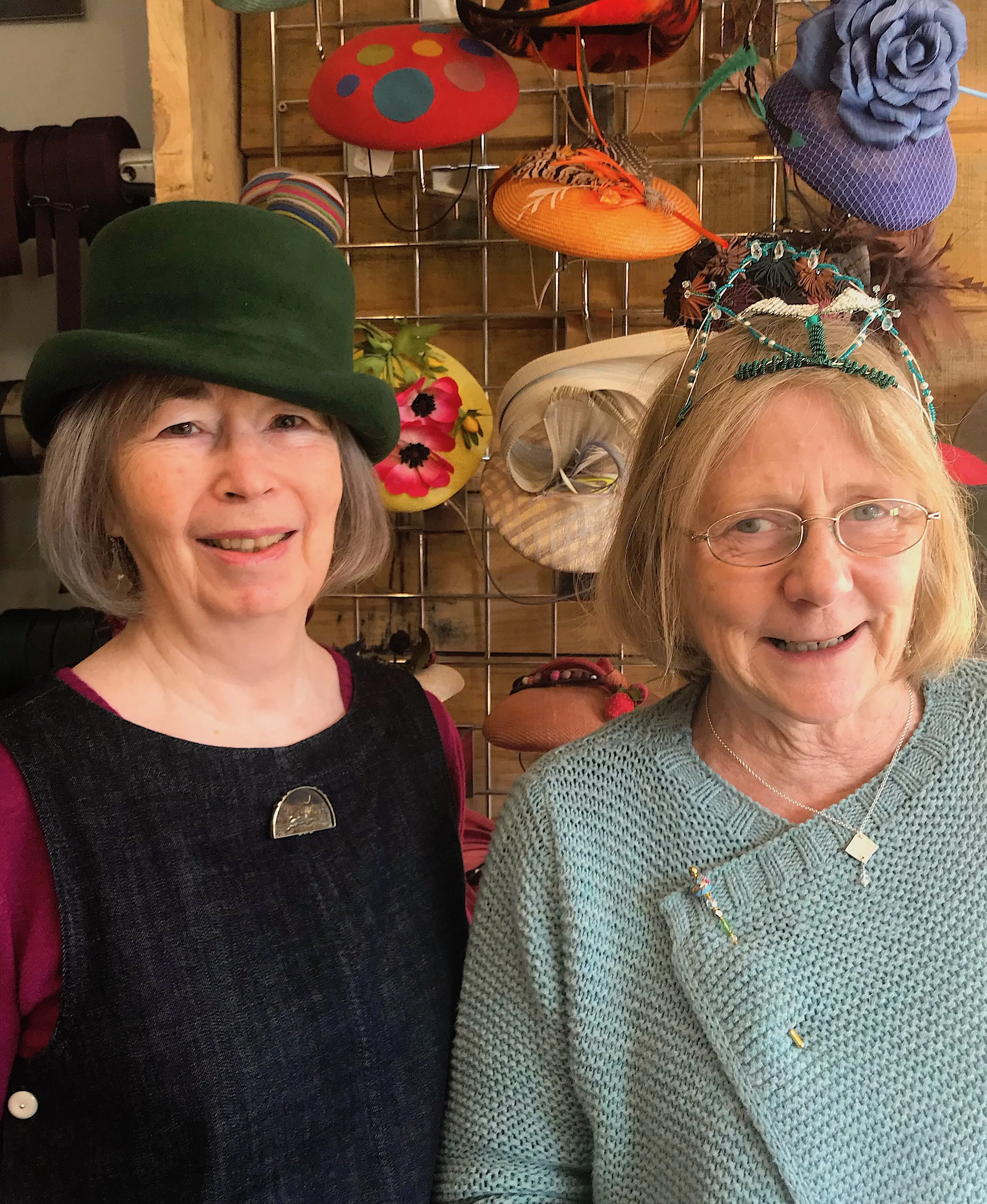 Lynn modelling one of her felt hats, and Verna wearing one of her beaded creations