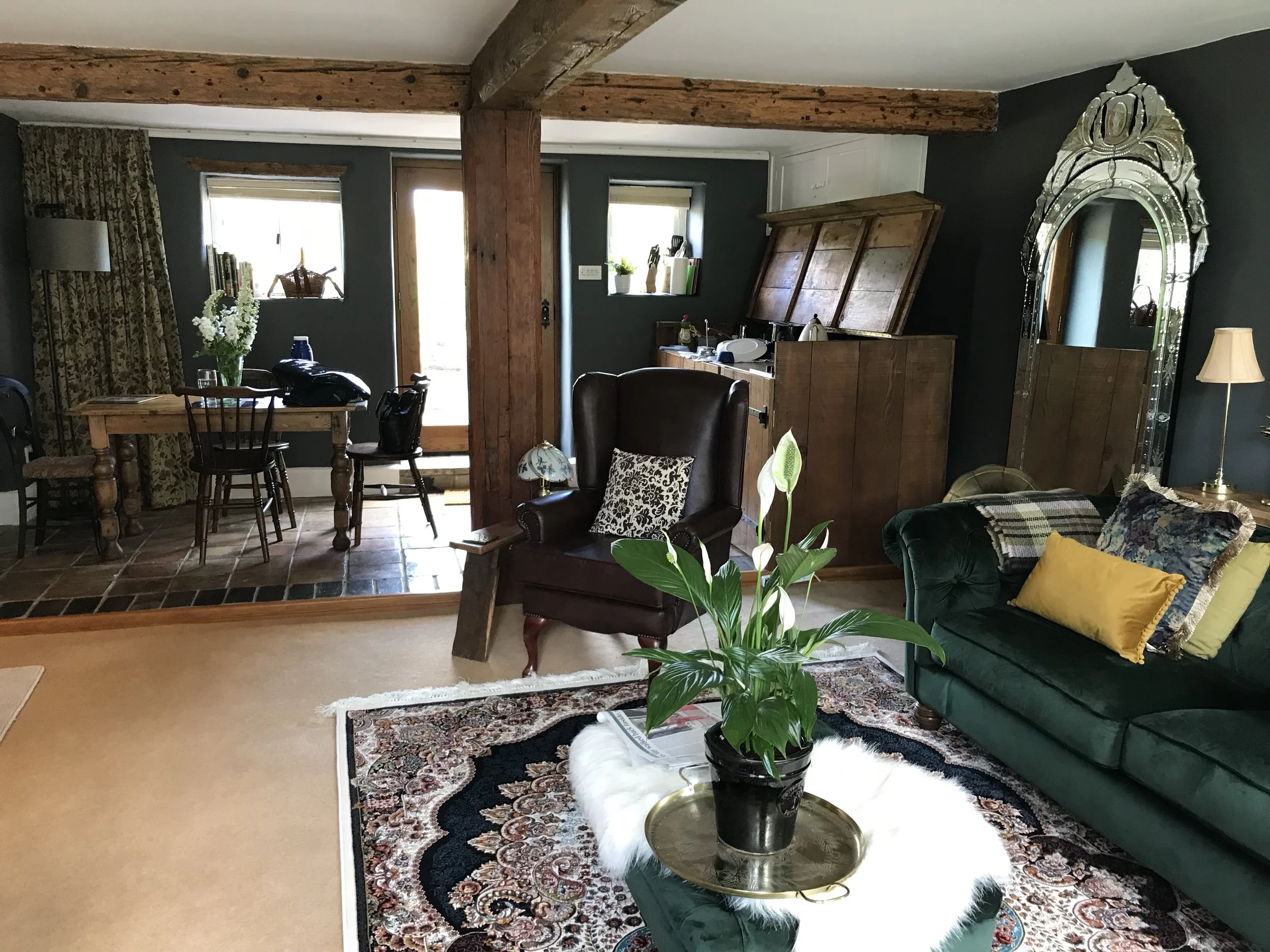The open-plan living, dining and kitchen room in our beautifully decorated and furnished 16th century Airbnb