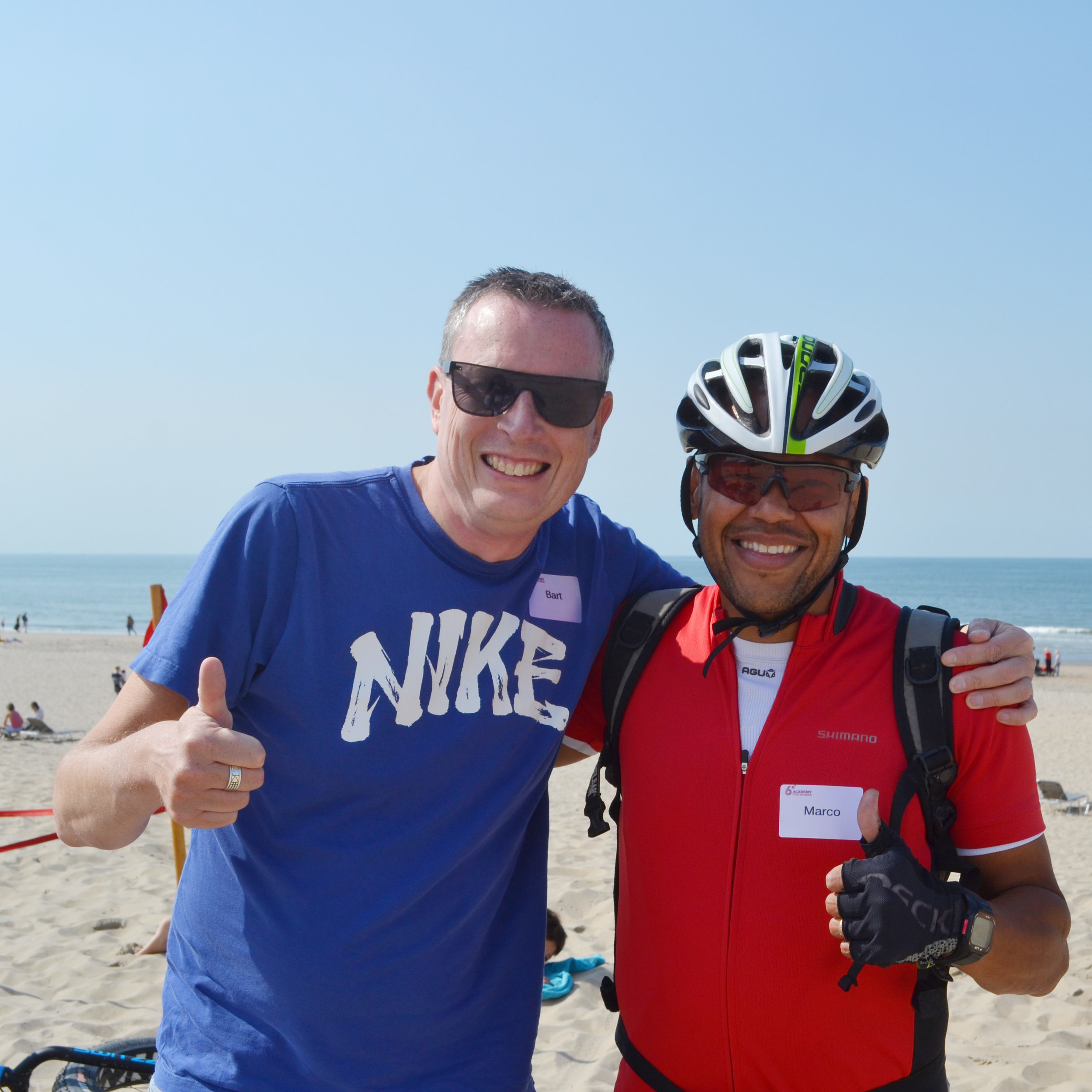 Beach-biking satisfaction between Marco and Bart, one of our partners