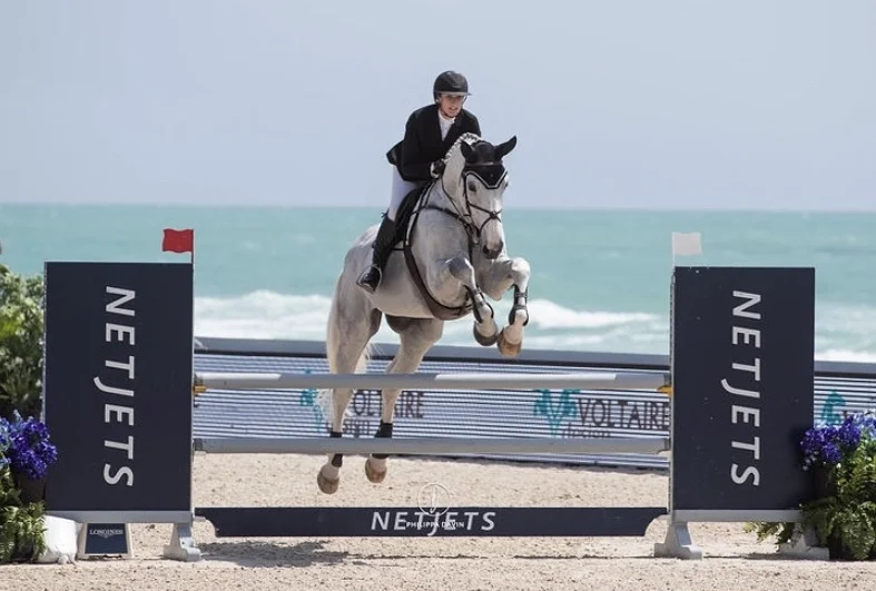 Misty riding Snoopy in the Miami Beach Longines Global Champions Tour this year.