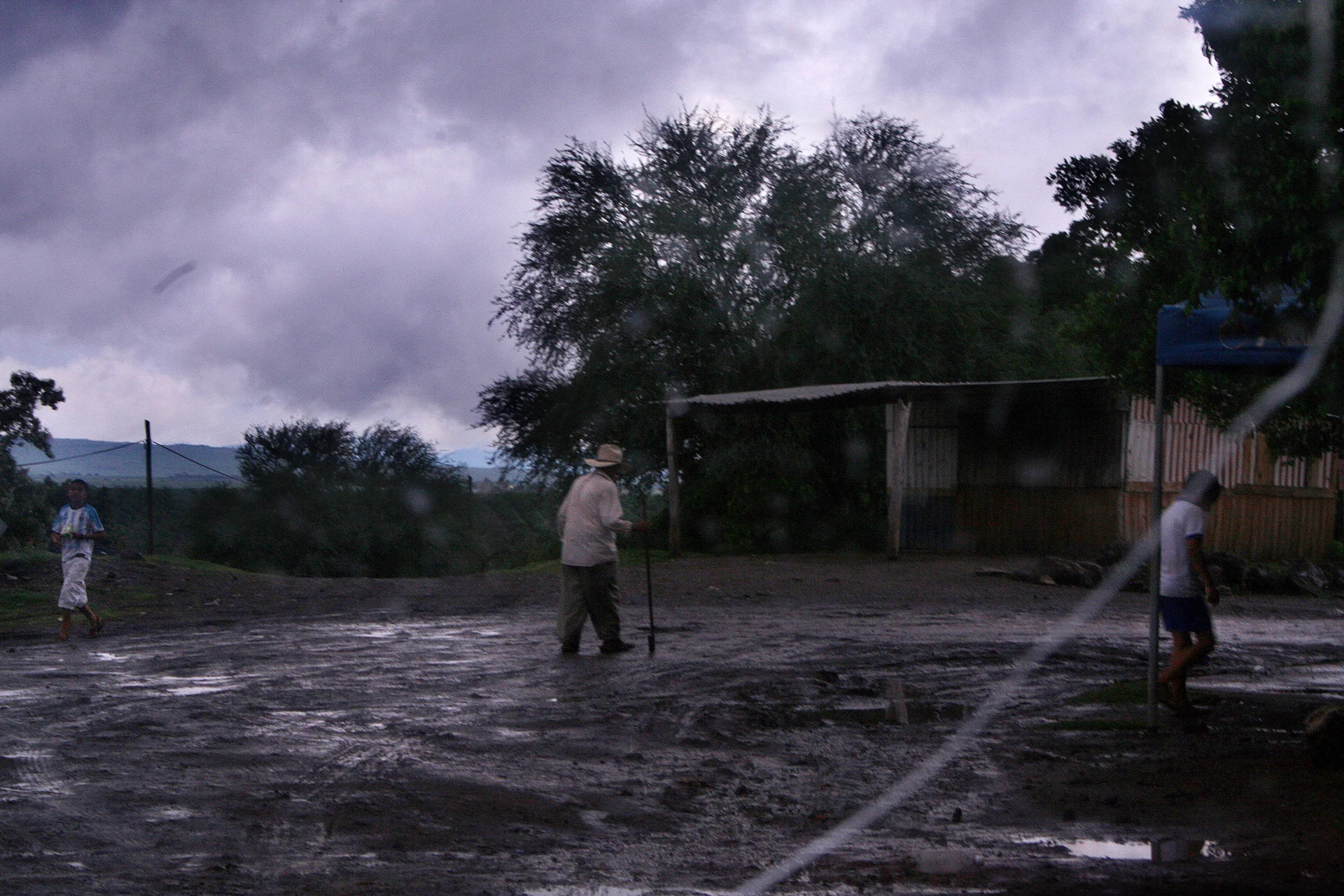 A rural back road in Michoacán State. Such areas are abjectly poor resulting in Michoacán being one of the states in Mexico where people emigrate to the United States in high numbers. The state is known for its productive agriculture, however growing drug crops yield a much higher profit. What a farmer grows in a week equals the amount a laborer would make in a month picking crops in California. 