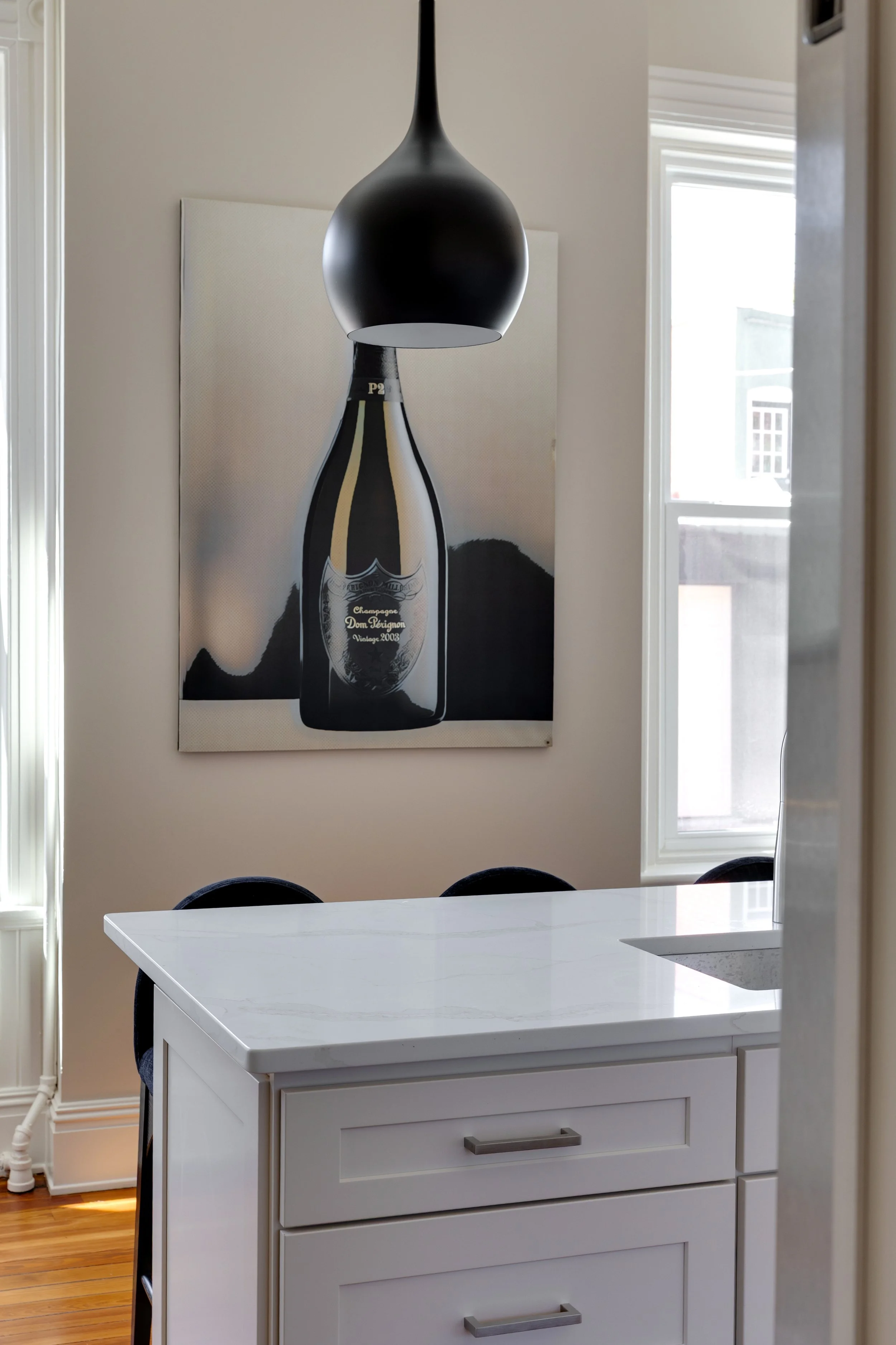 1-North-Harvie-Street-Richmond-VA-Professionally staged luxury living room in Richmond VA featuring modern organic interior design, black-and-white styling, sculptural furniture, oversized natural light windows, layered textures, 2.jpg
