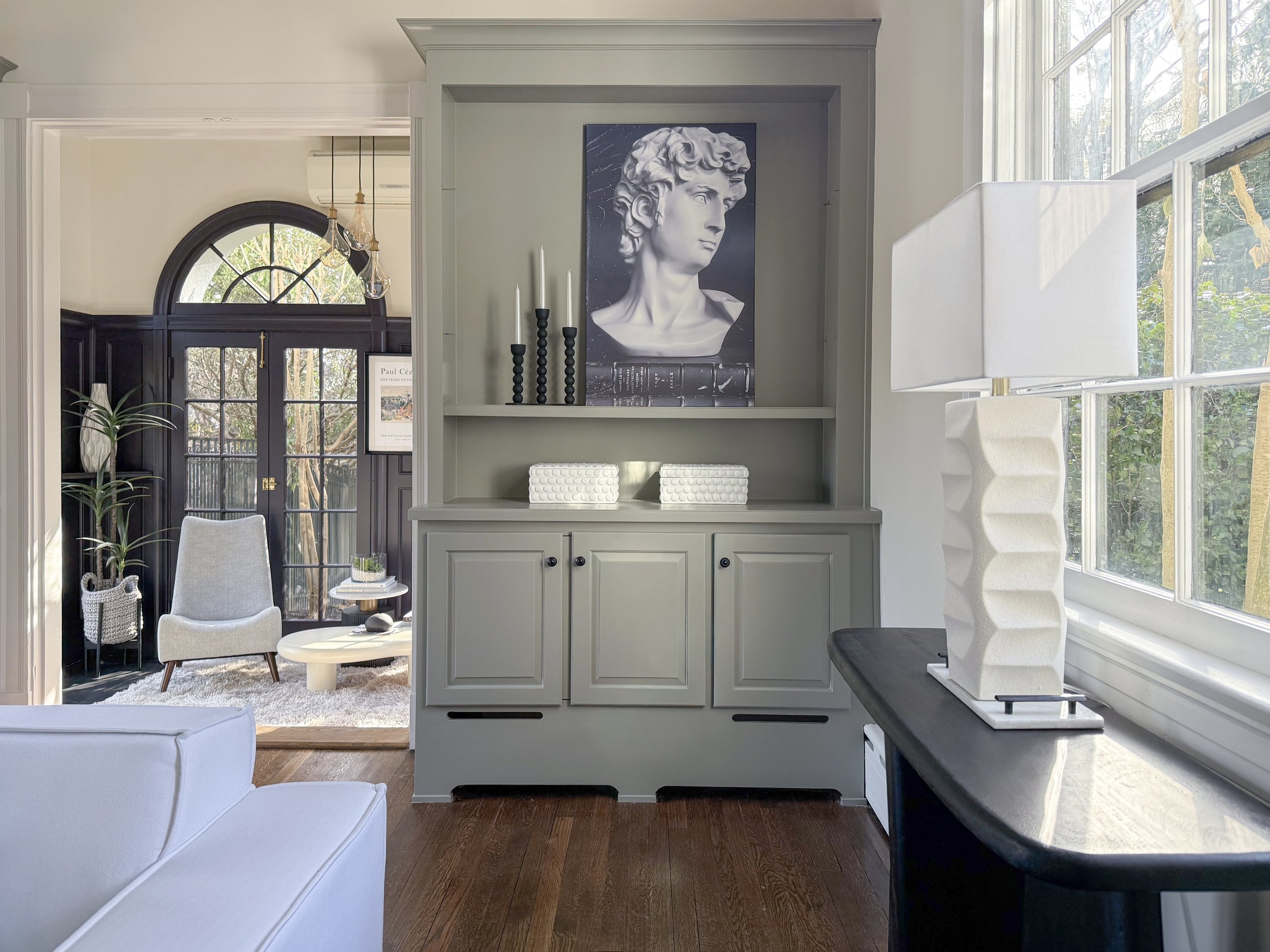 Custom built-in cabinetry and styled sitting area in a luxury Richmond, VA home featuring modern decor, natural light, and professionally staged interiors.