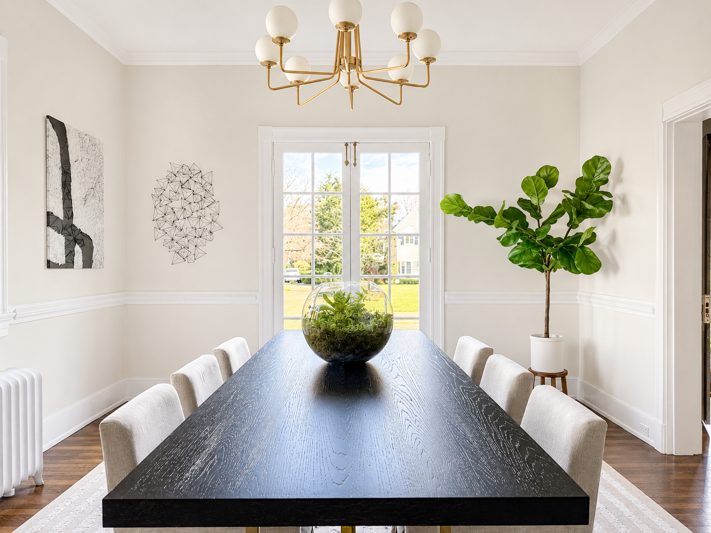 Modern staged dining room with upholstered chairs, neutral interiors, natural light, and designer styling in a Richmond, VA home.