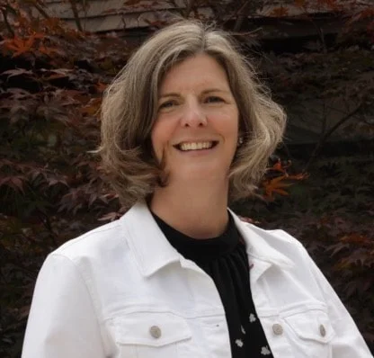 Lynette Kreidler in a white summer jacket and black blouse
