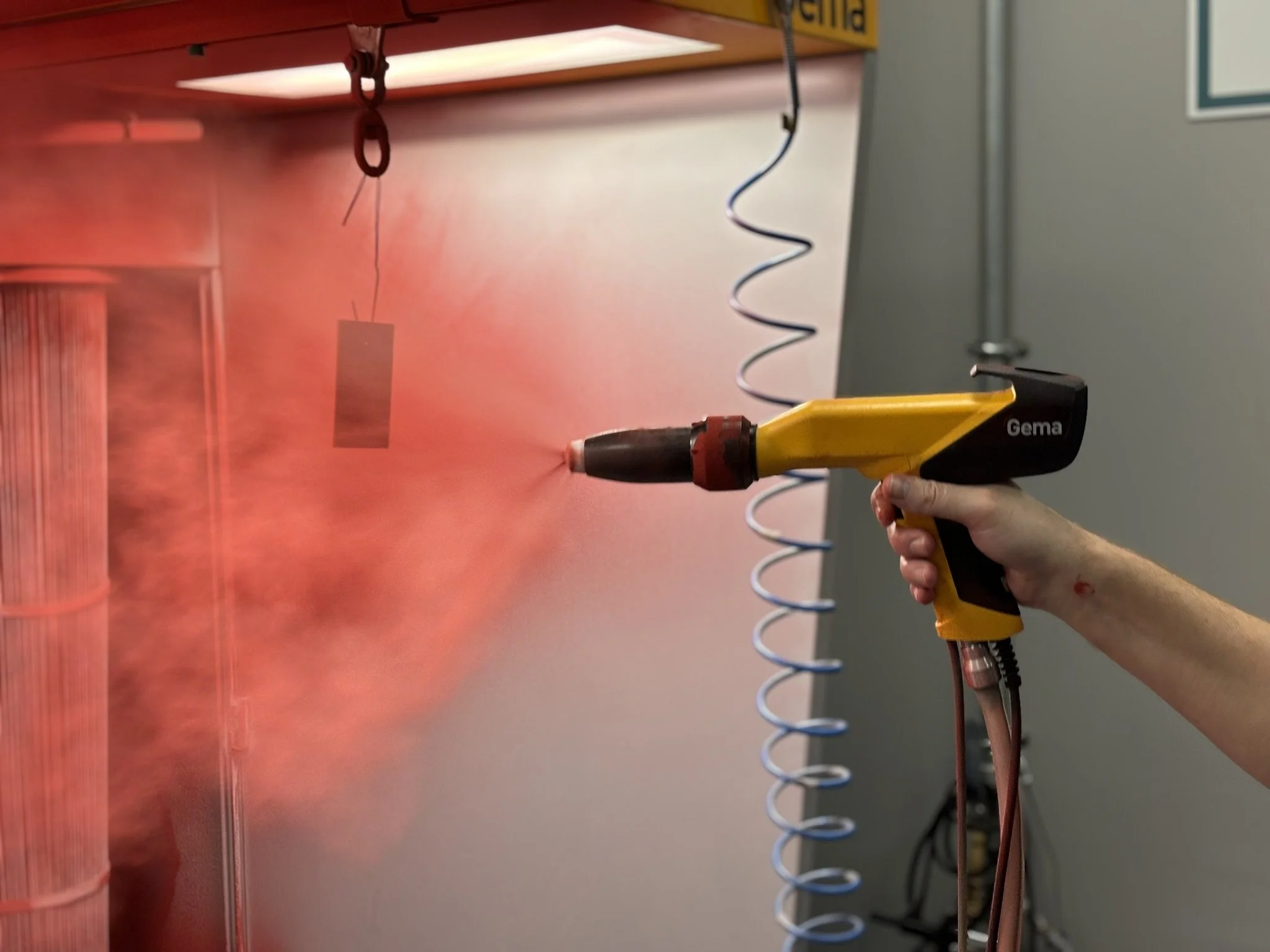 Aluminium coupon being sprayed with dielectric coating.JPEG