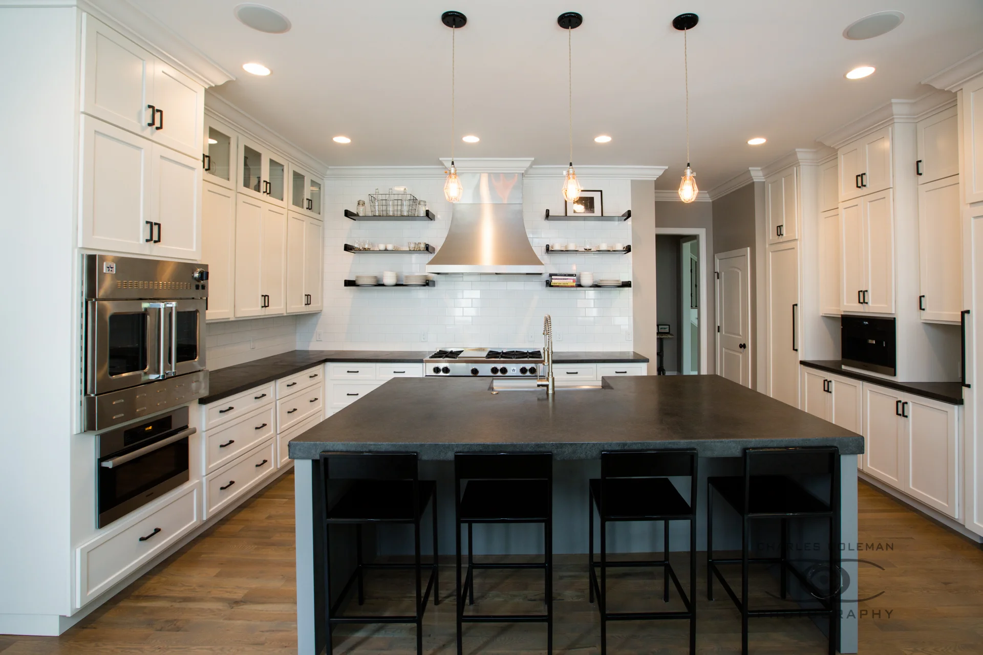 A large dark grey and black island top with matching counter. #residential
