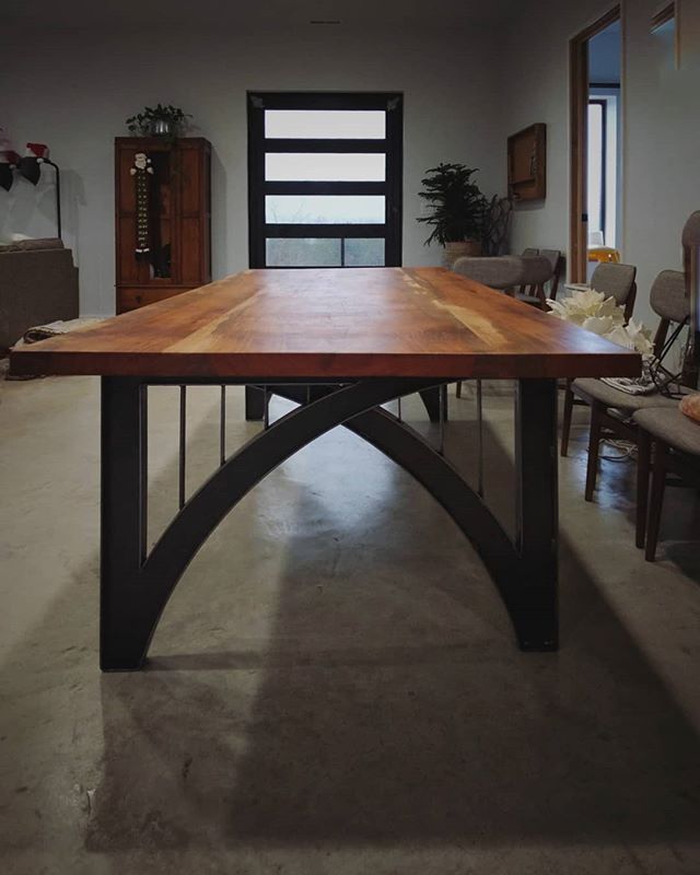 A custom dining table with a thick cherry wood top and a bridge inspired base. #furniture