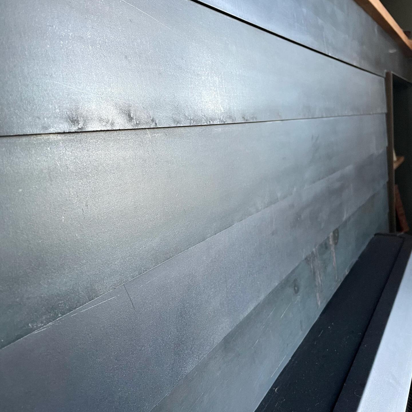 An interesting custom fireplace surround. Strips of steel overlaying each other brings more texture to this dramatic space. #steelfabrication #chattanoogatn #chattanoogabusiness #smallbusinessmarketing #americanmadefurniture #architecture_minimal #fi
